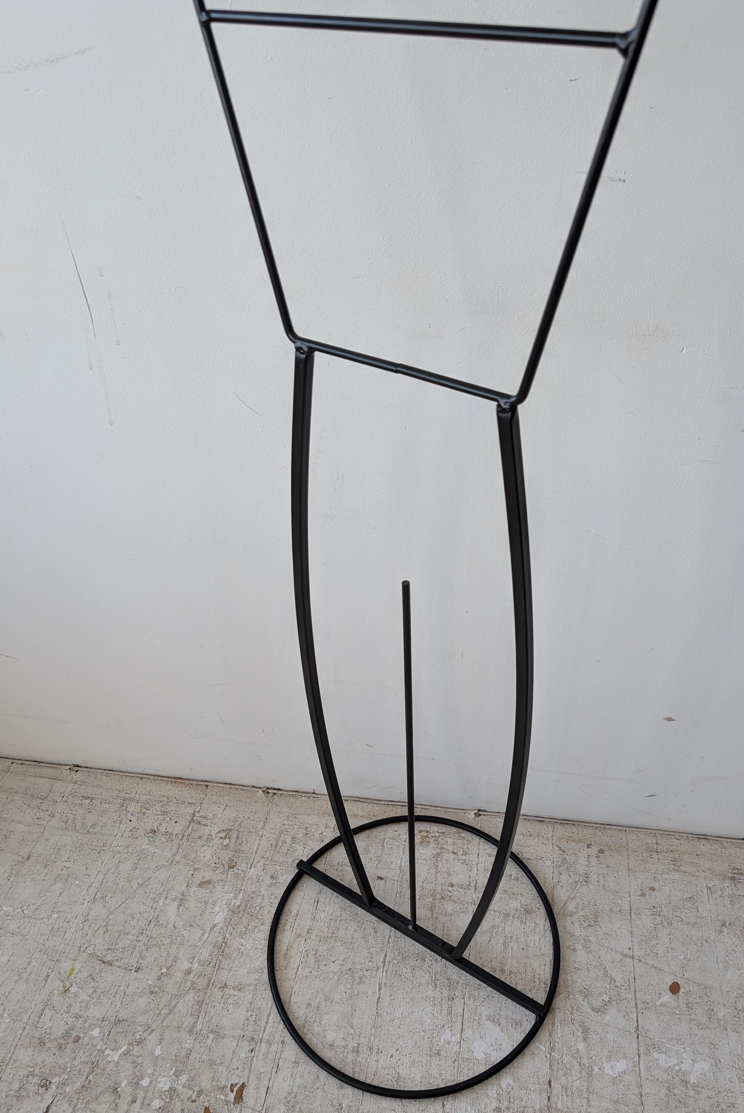 Metal Pair of postmodern John Risley style black metal figural valet stands, USA 1980s