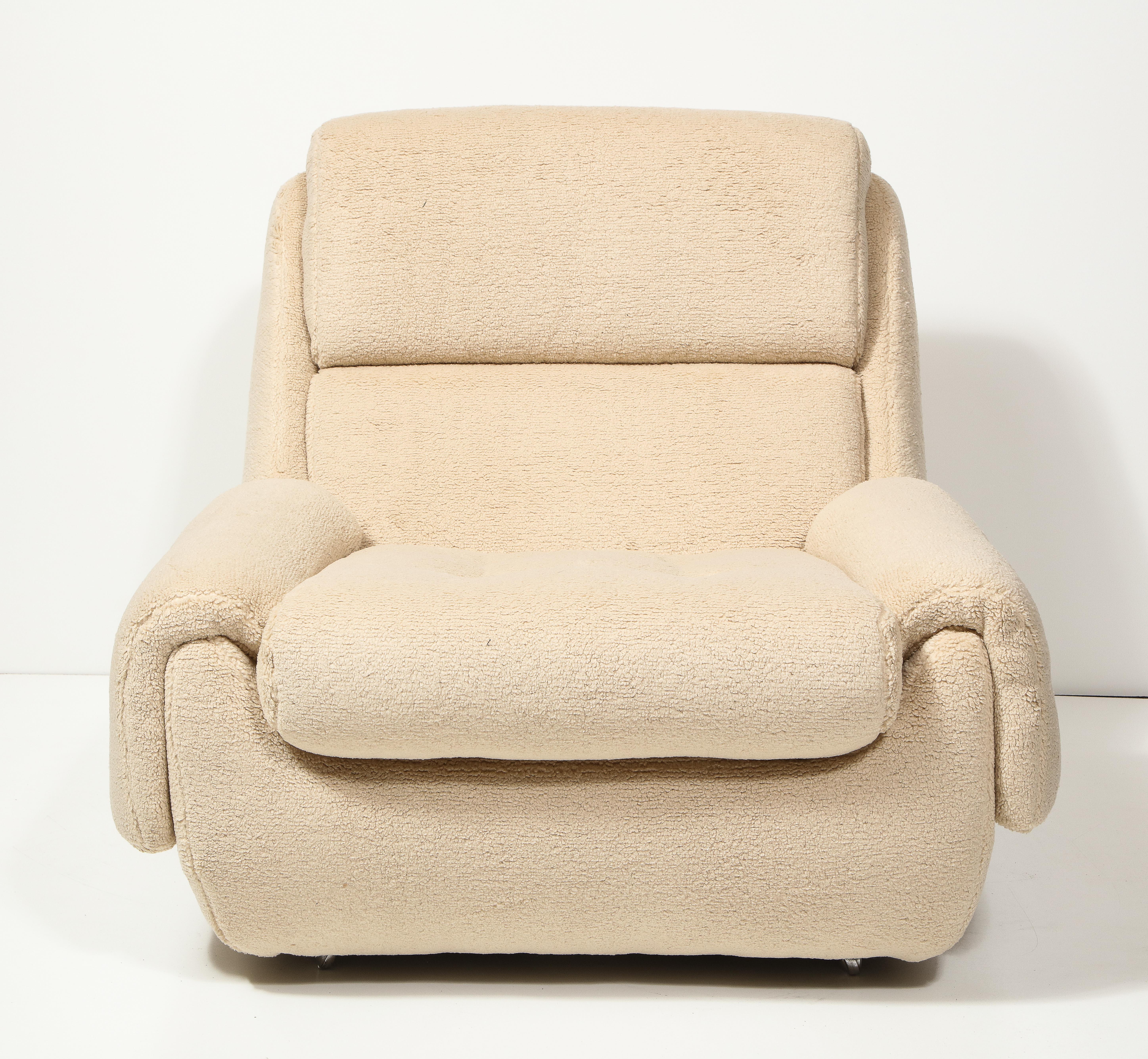 Two available; priced individually.

Postmodern, inviting lounge chairs with a low profile and original boucle upholstery.