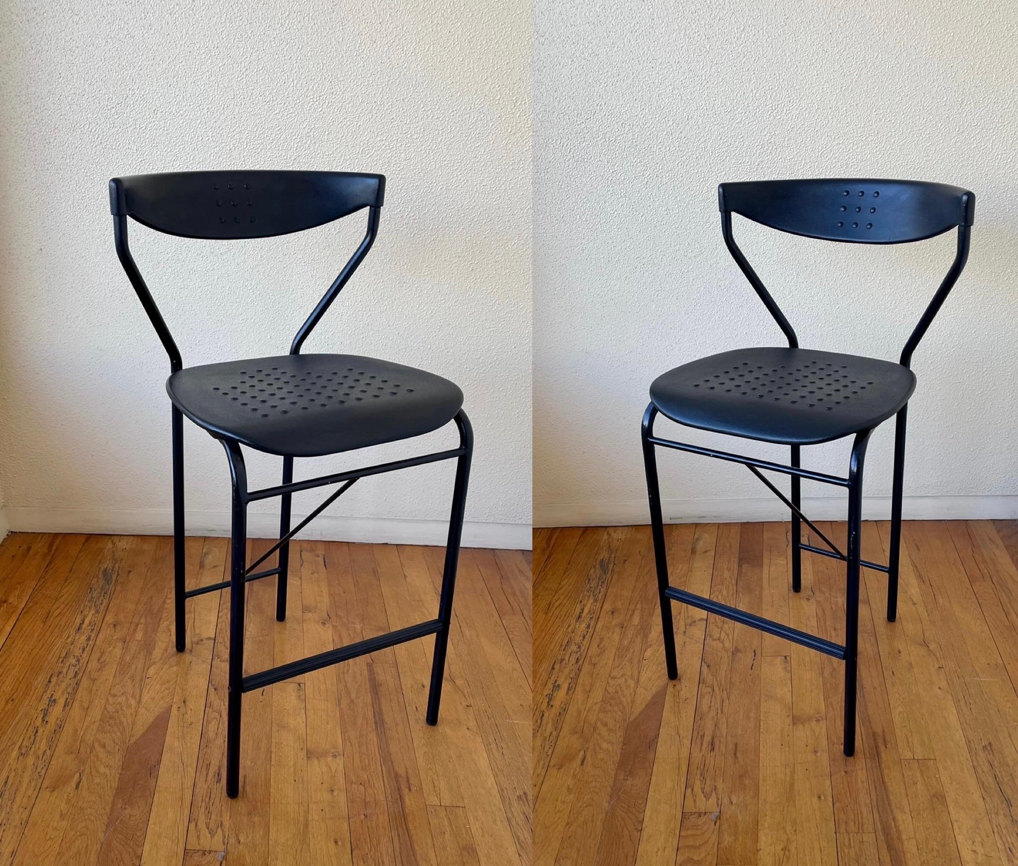 Nice pair of Italian bar stools, Made in Italy circa the 1980s, black tubular pipping with black rubber backrest, and seat, its really nice and comfy rubbery material, the stools are nice solid and sturdy, with a total Memphis look.