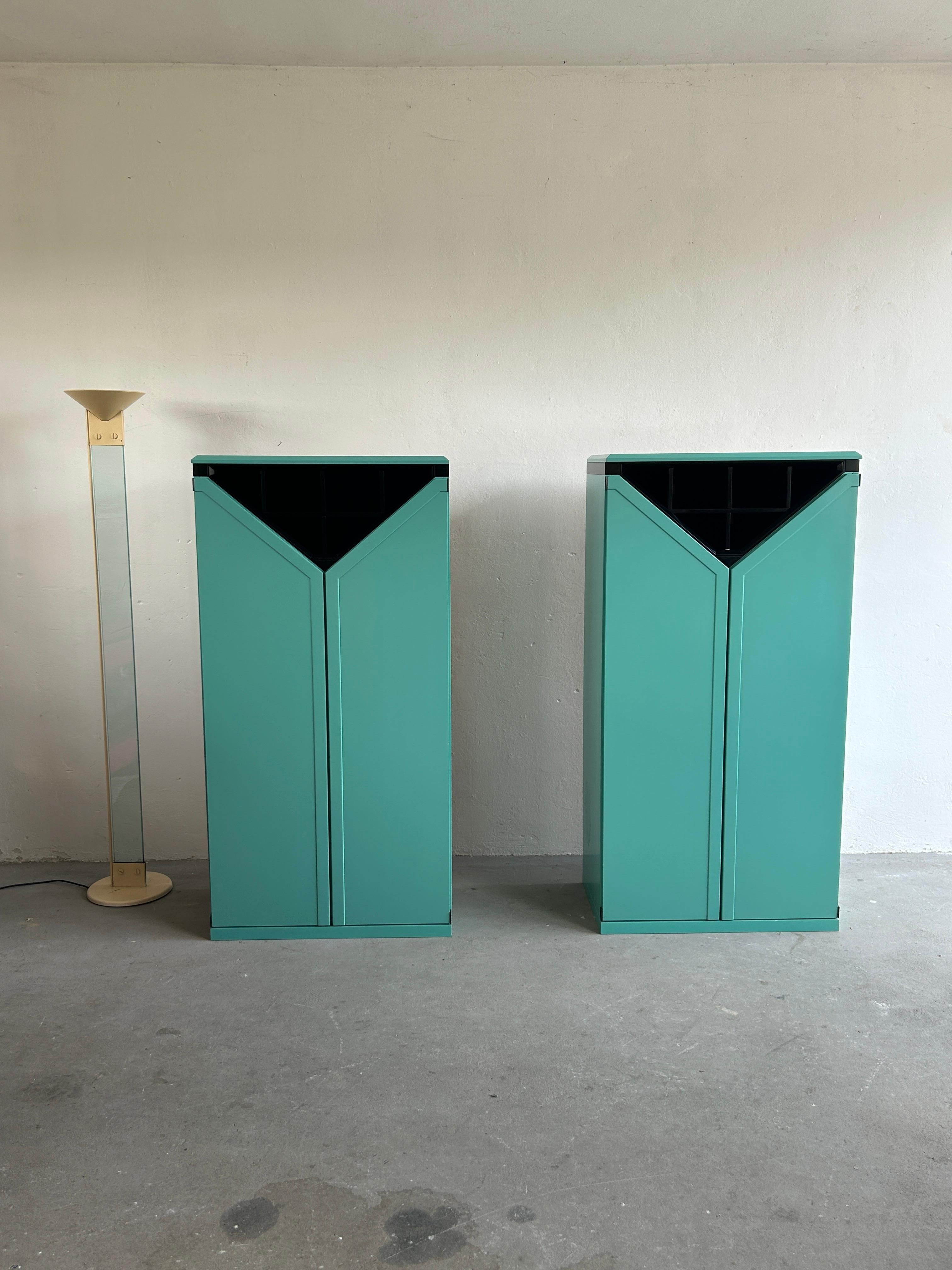 A pair of unique and rare European made postmodern Memphis style bar cabinets, produced by Kapo Möbelwerkstätten, and Austrian furniture producer founded by Karl Polzhofer in 1927.
The bar cabinets were made to order for a wealthy Austrian family