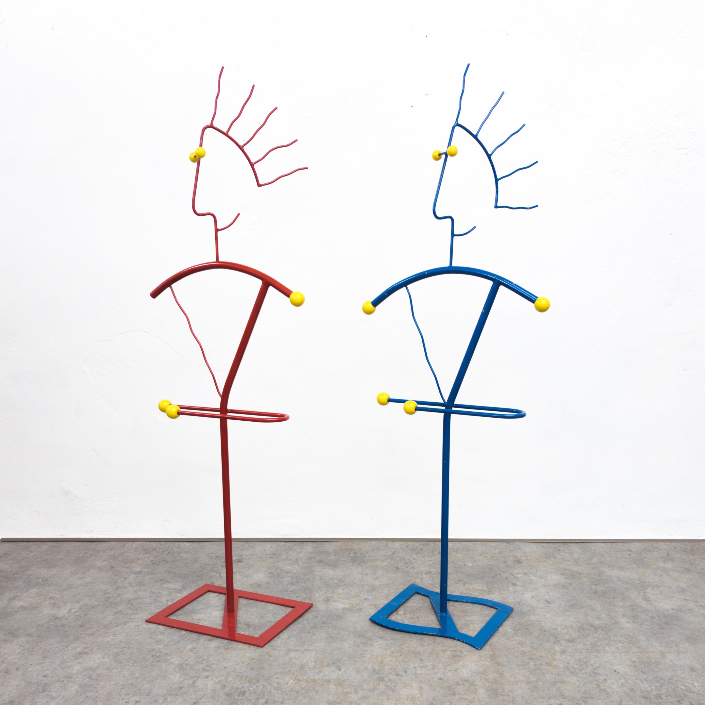 Pair of unique postmodern coat stands from the 1980s / 90s. Made of red and blue lacquered metal. In very good original condition with some minor scratches on the lacquer. Height 153 cm, width 55 cm, depth 32 cm.