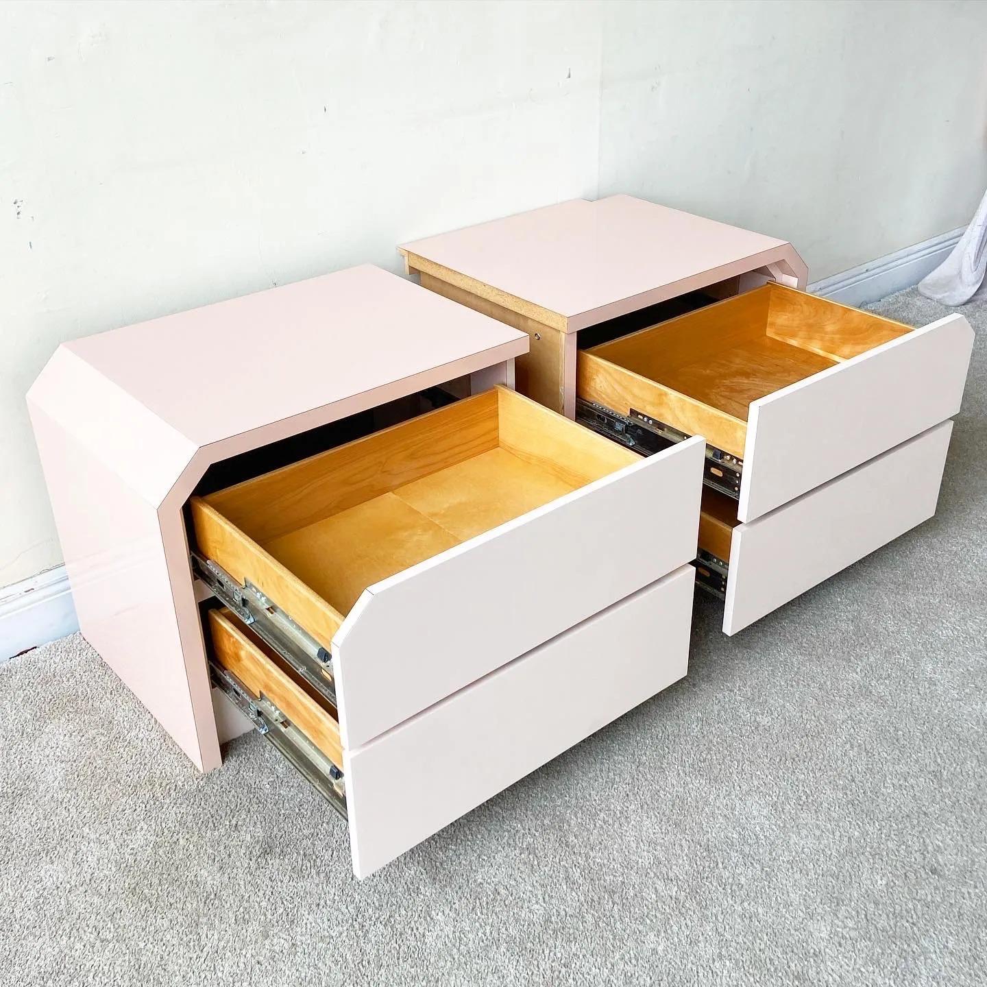 Exceptional pair of 1980s custom postmodern nightstands. Each nightstand features a pink and light pink lacquer laminate with 2 spacious drawers.

Additional information:
Materials: Laminate, Wood
Color: Pink
Style: Postmodern
Time Period: