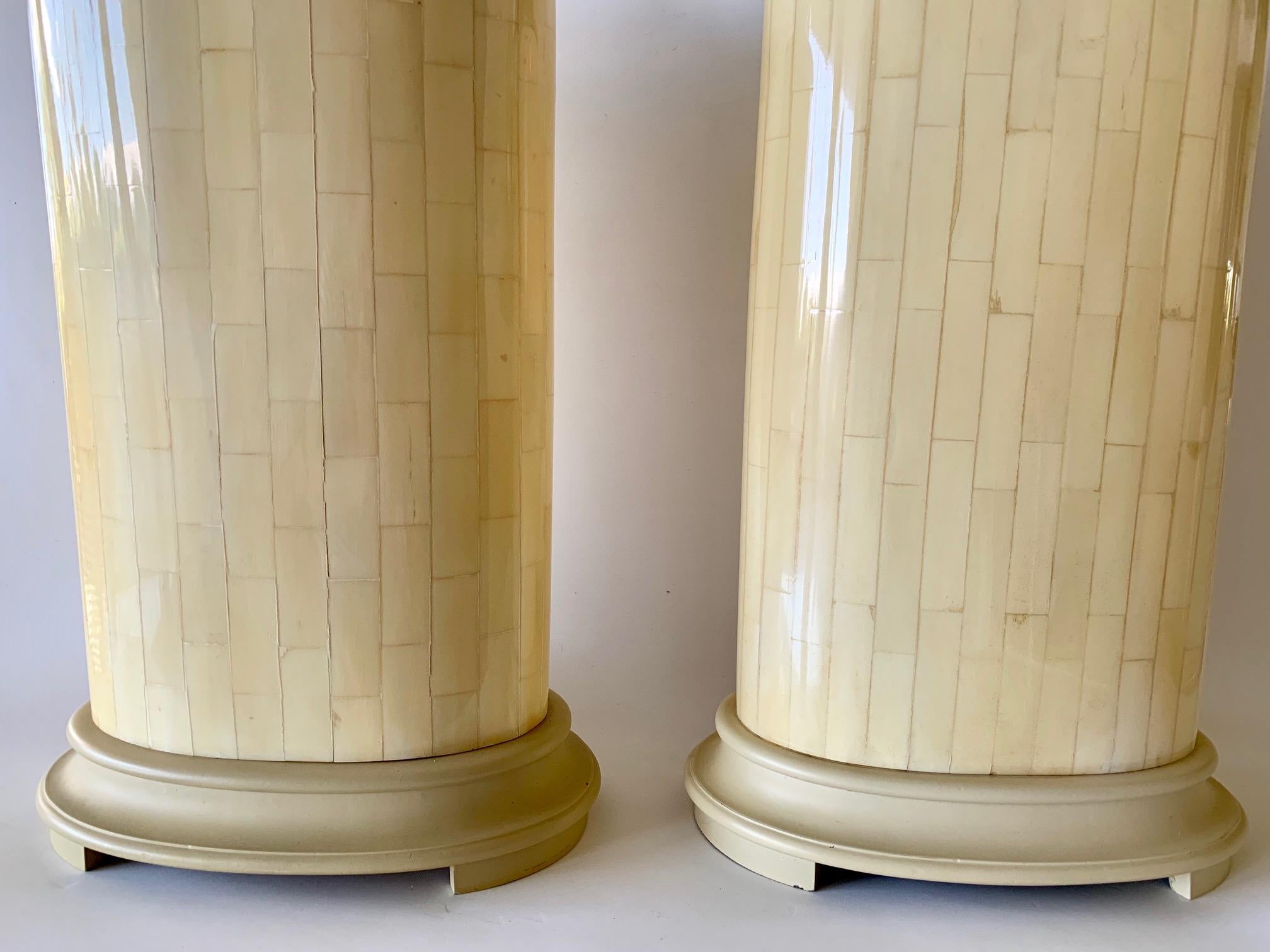 Glamorous Postmodern tessellated stone table lamps, circa the 1980s. These striking lamps are designed with tessellated bone and wired with brass fittings. The lamps feature an oval shape which creates a unique simplistic striking design. The