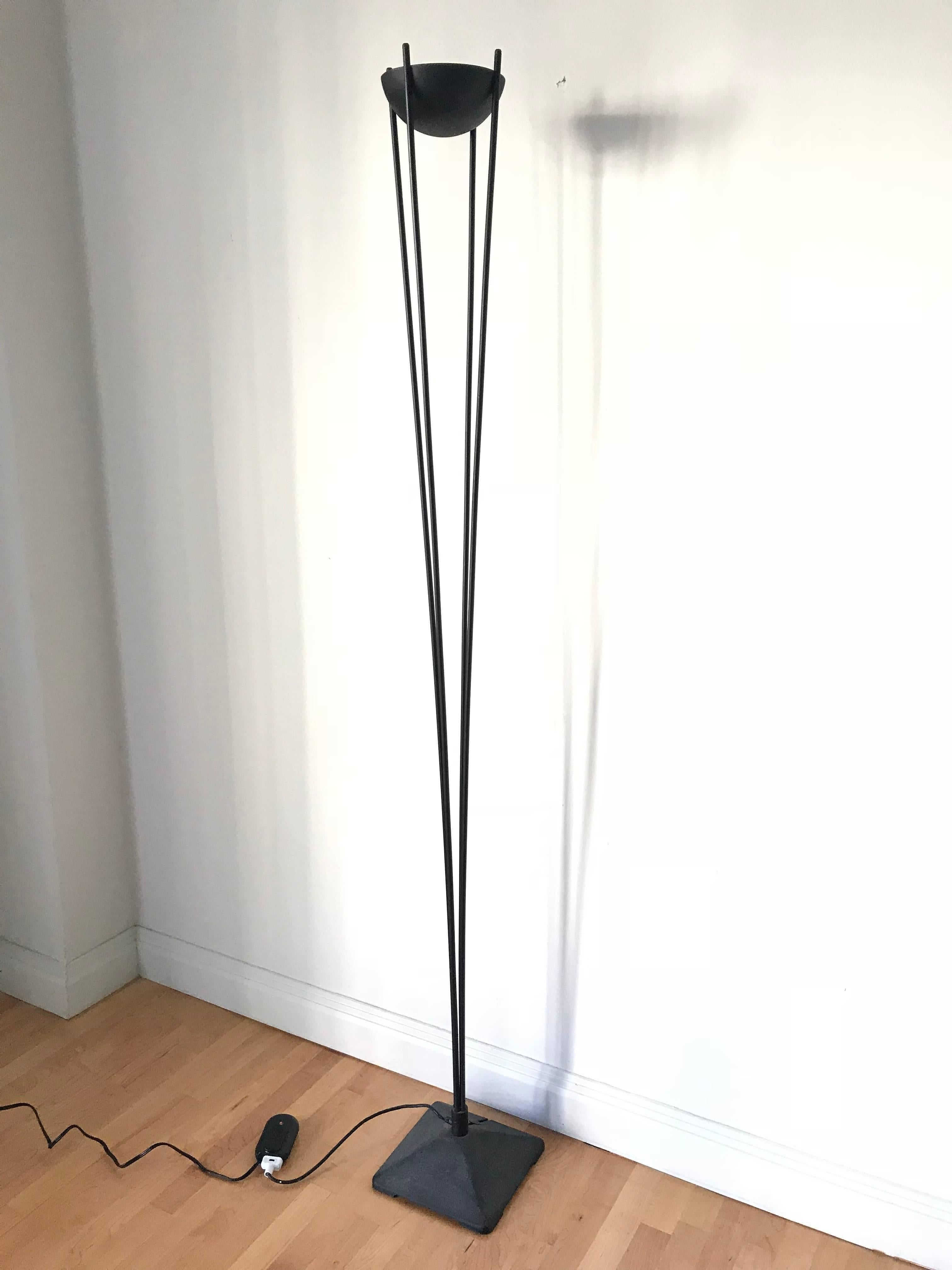 Koch & Lowy Postmodern torchiere floor lamps with a weighted base holding four rods supporting an inverted cup light holder, rendered in black powder coated steel.