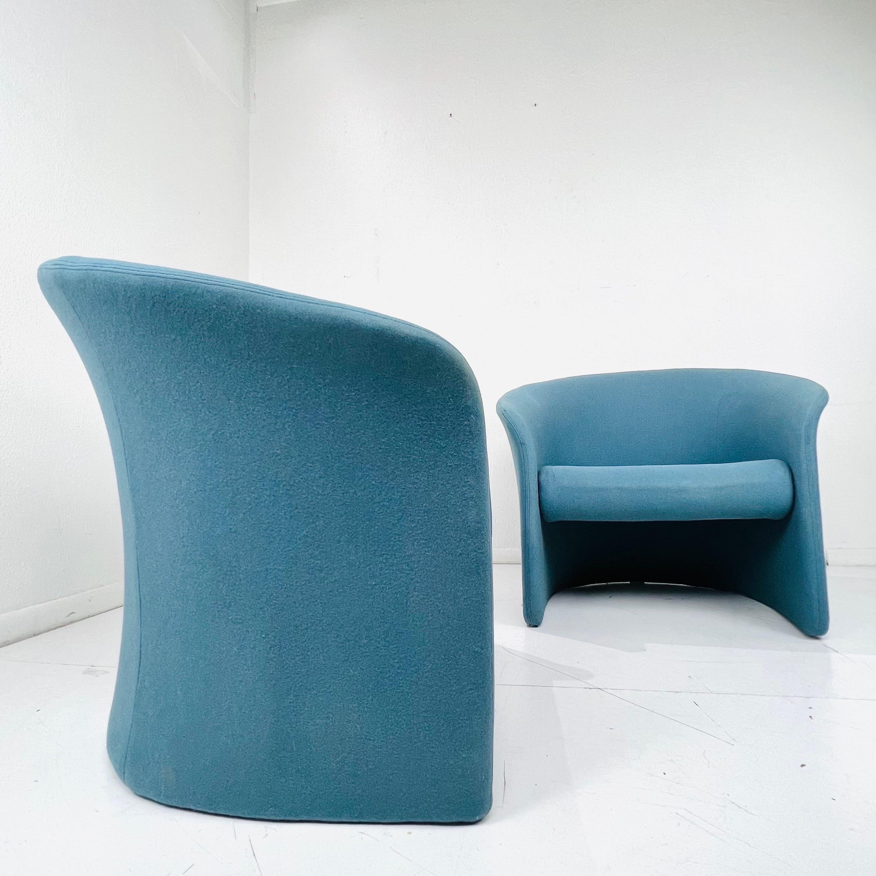 Vintage pair of postmodern Rotonda tub chairs by Massimo Vignelli for Sunar Hauserman , 1979. These feature a gently curved back and sides with floating seat fully upholstered in light blue fabric stretched over a tubular steel frame with foam