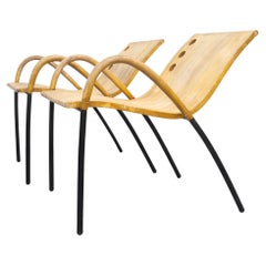 Pair of postmodern tubular steel lounge chairs, 1980s