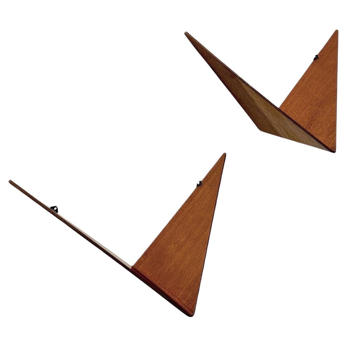 Rare pair of Poul Cadovius Butterfly Shelves, designed in 1958 and manufactured by Royal System in Denmark.

Made of delicate moulded teak plywood and two small metal hooks to mount with nails or screws. 
These look beautiful as a small bedside