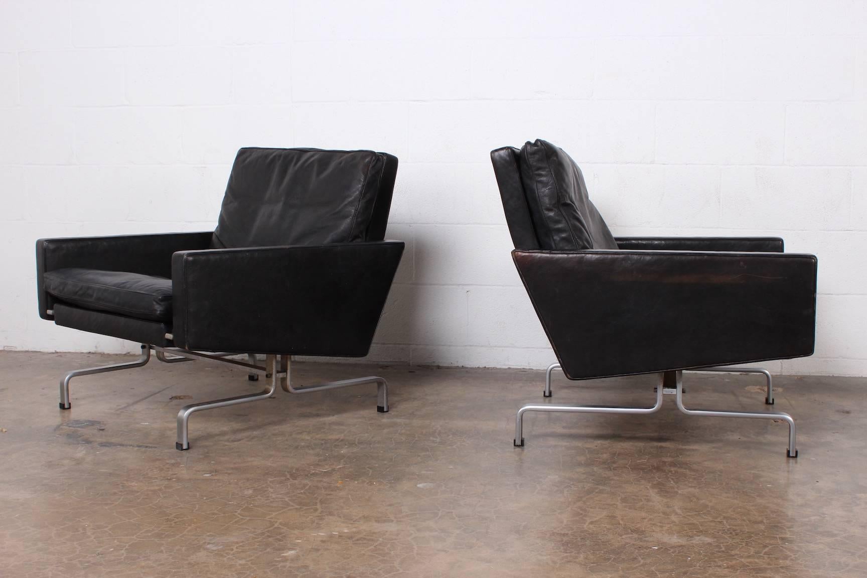 A pair of Poul Kjaerholm PK-31/1 lounge chairs for E. Kold Christensen in original black leather.