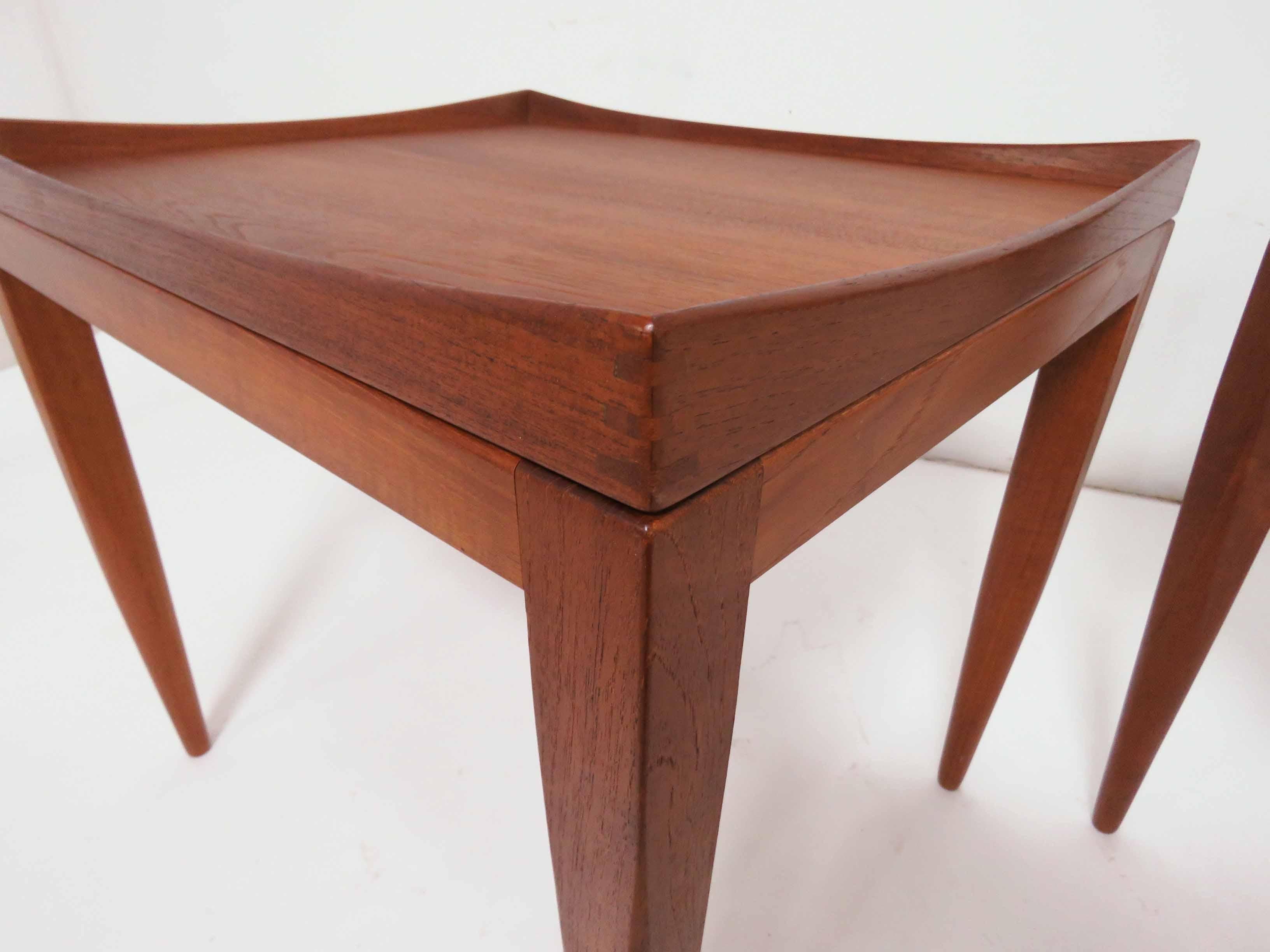 Pair of teak end tables with removable tops, by PMJ (Poul M. Jessen), Denmark, circa 1960s. Exquisite examples of Danish craftsmanship, trays with gently peaked corners and exposed finger joints.