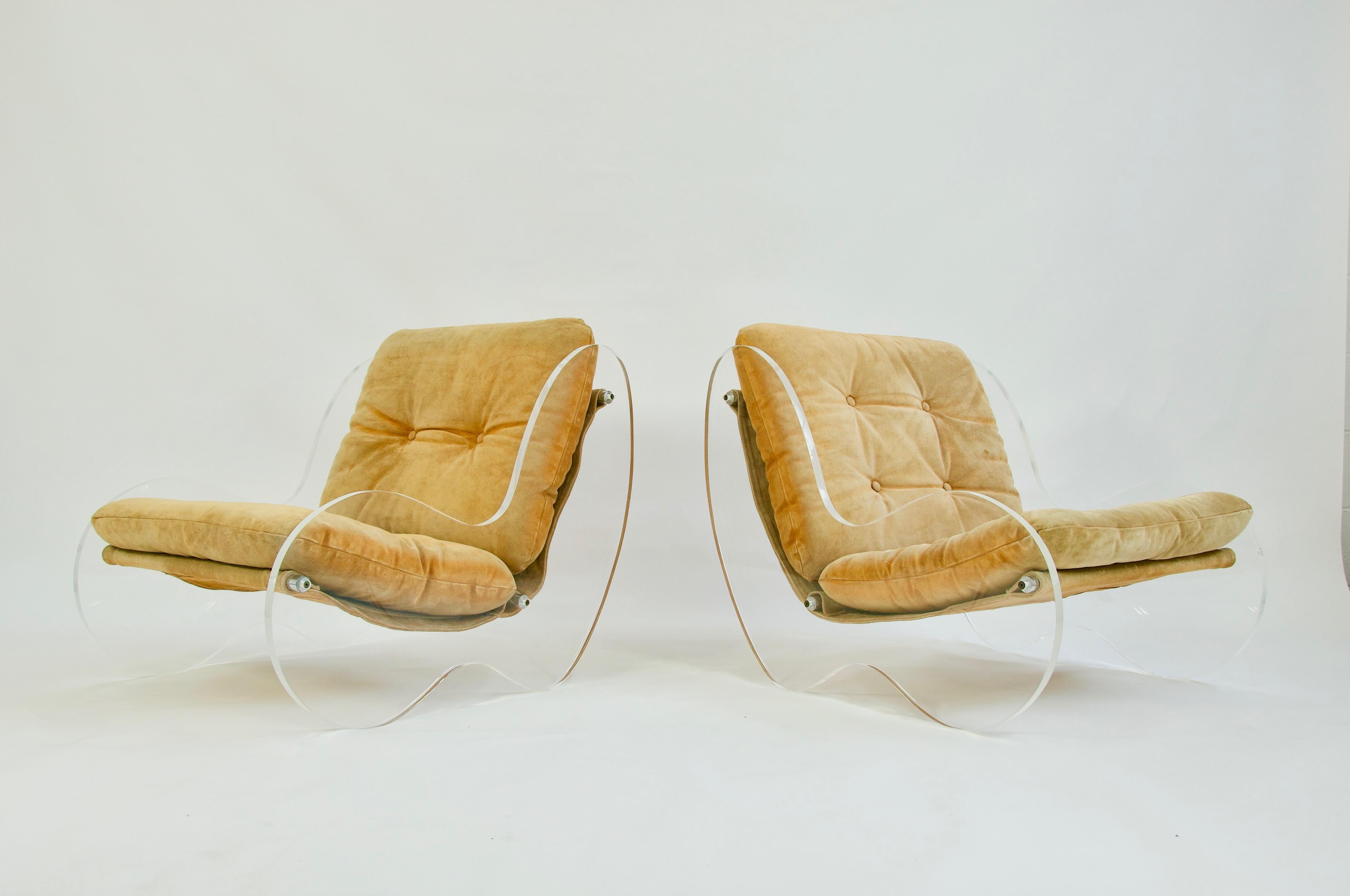 Offered by OLIVER MODERN Rare pair of sculptural Lucite lounge chairs by Poul Norreklit. Original suede sling seating. Lucite has been polished.