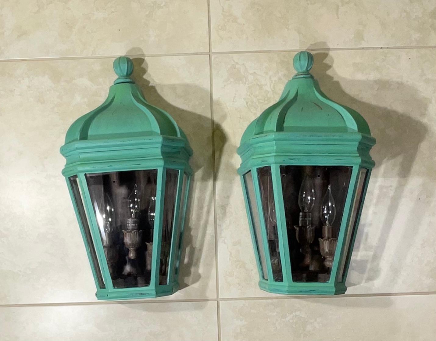 Pair of elegant outdoor  lights  made of power coated aluminium , hand painted  , ample light exposure of three 60/watt lights  , solid quality craftsmanship , suitable for wet location 
Up to US code UL approved.