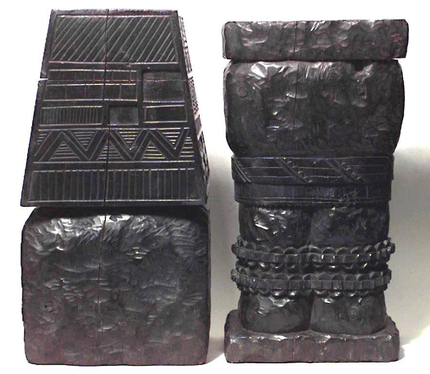 Pair of Pre-Colombian style ebonized wood carved figures with hidden compartments (19th-20th century).
  