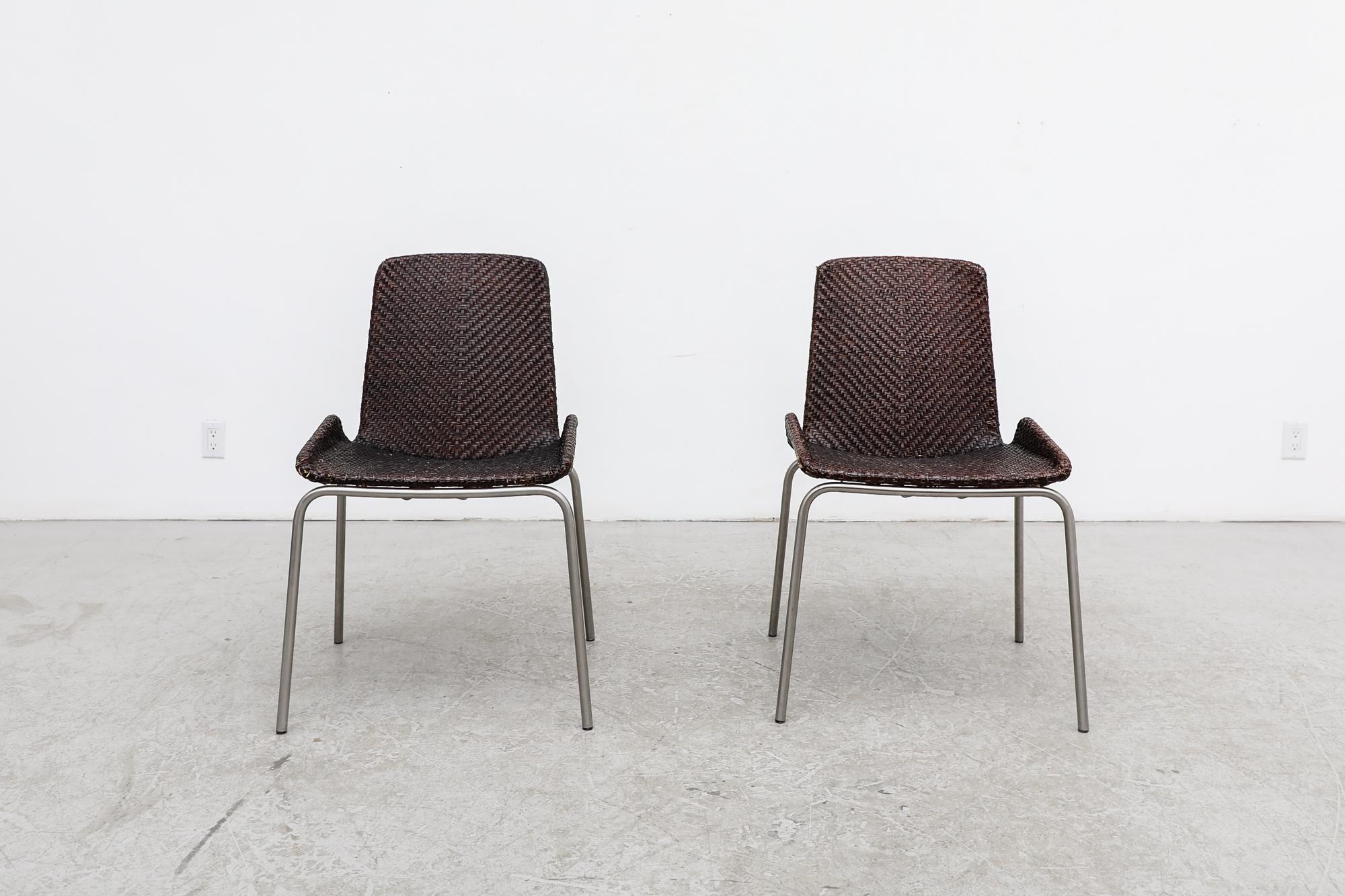 Pair of vintage, mid century, hand woven leather side chairs with chrome legs. In original condition with visible wear consistent with their age and use. Set price. Shown with a set of 4 matching armchairs available, listed separately