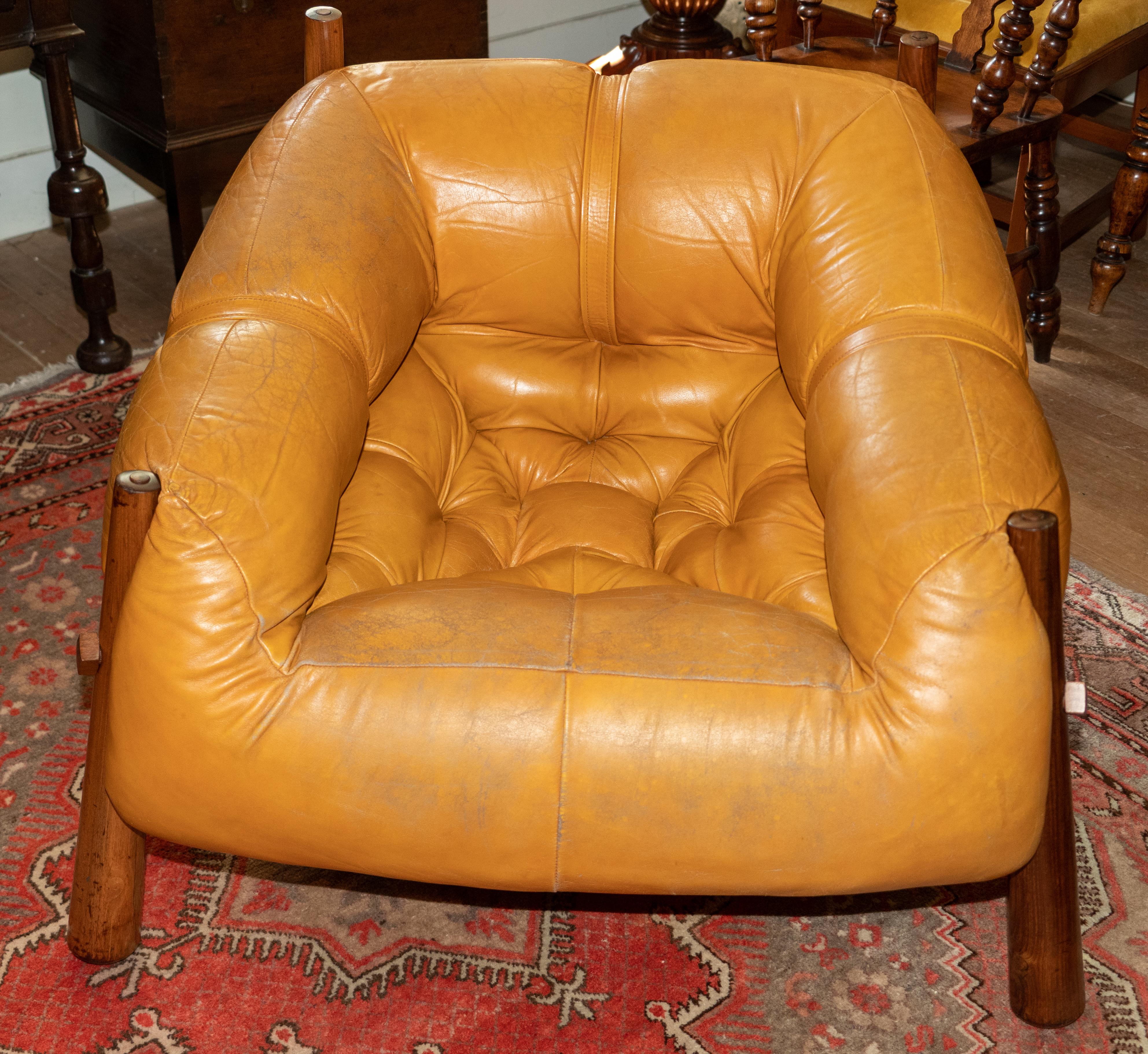 Pair of Percival Lafer (Brazilian designer) Iconic lounge chairs. Model MP-81, circa 1960s.
Original leather and rich, dark hardwood. These iconic chairs have Lafer's signature reverse tapered leg with oversized wood bolt and button detail on their