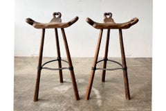 Pair of Primitive Carved Wood “Birthing” Bar Stools