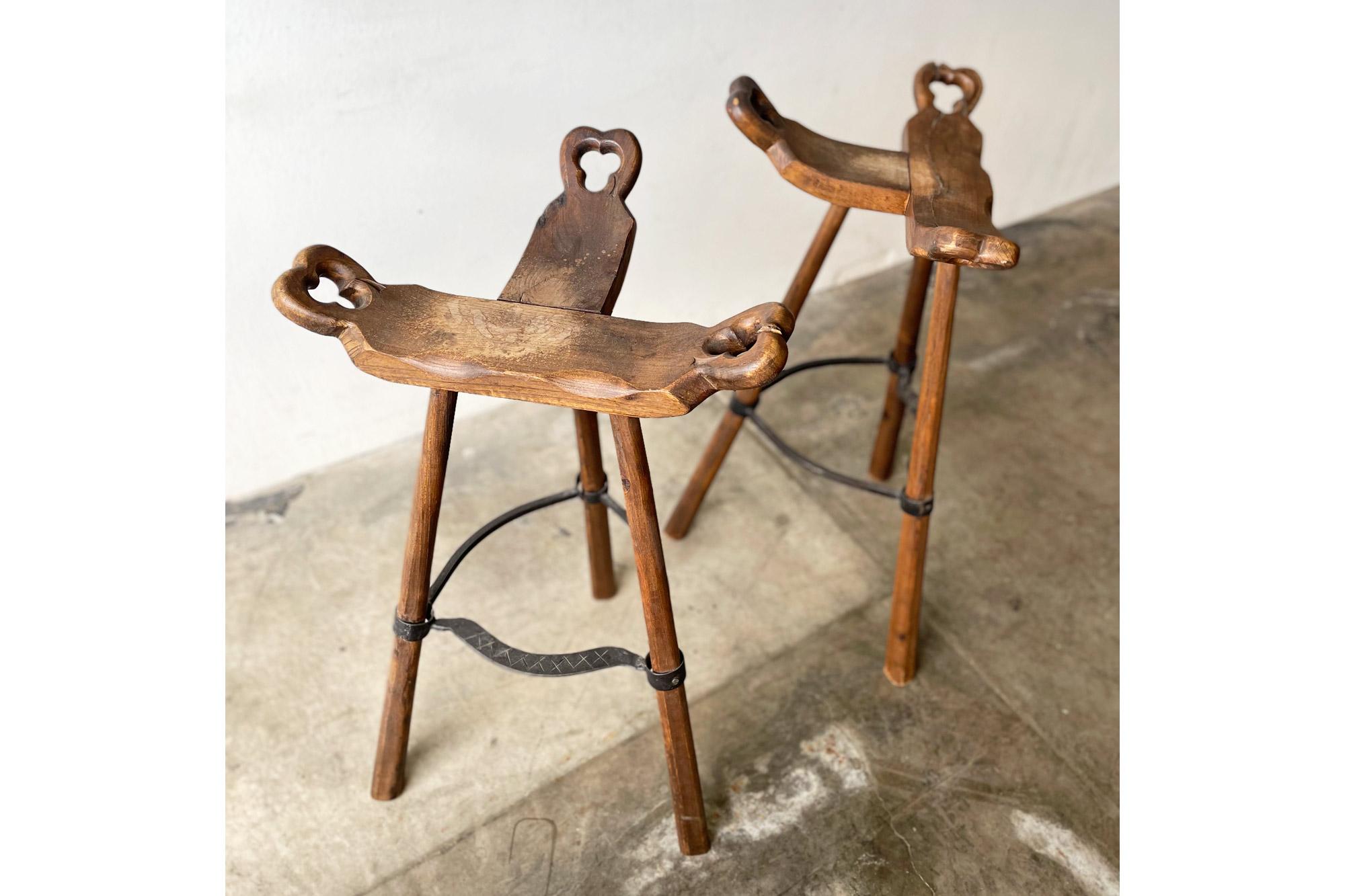Mid-Century Modern Pair of Primitive Carved Wood “Birthing” Bar Stools For Sale