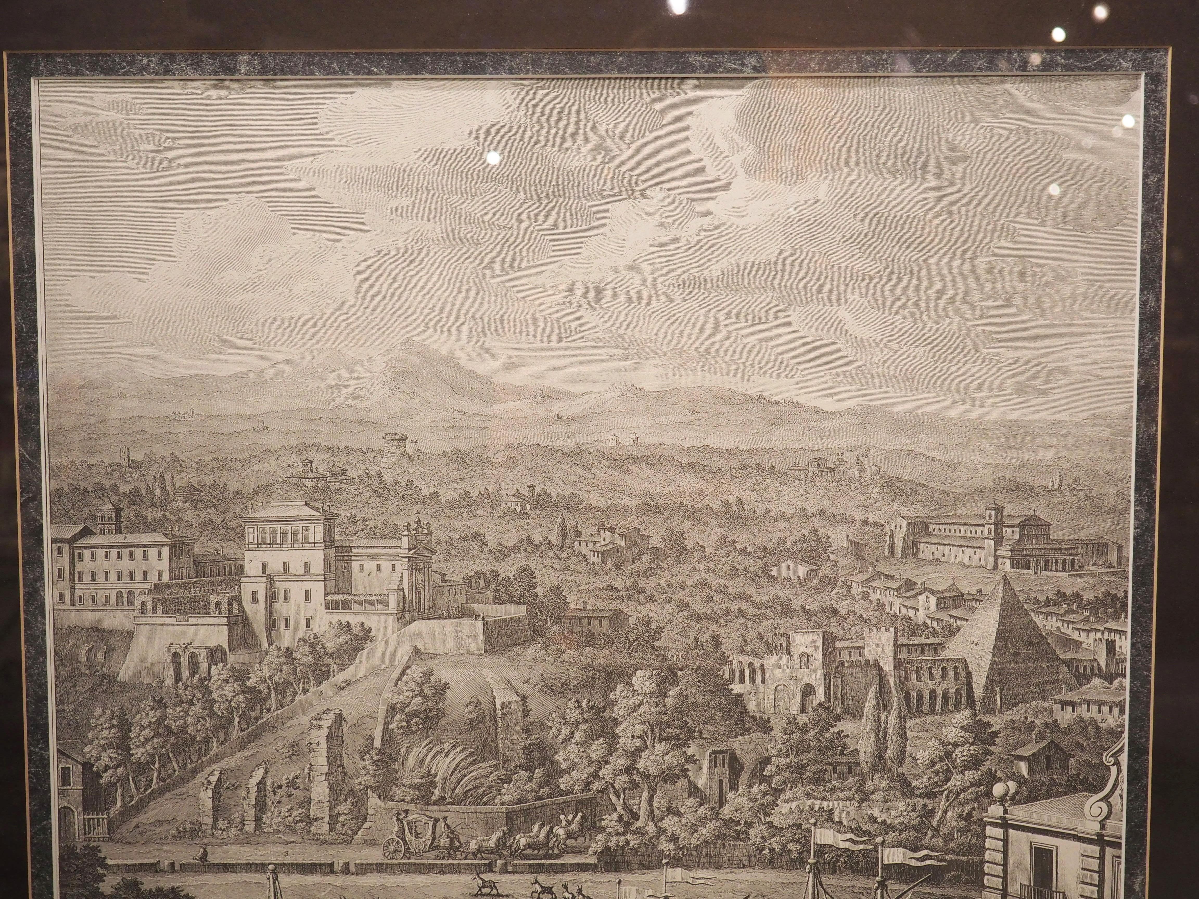 After a pair of engravings made by the Italian vedutisti, Giuseppe Vasi, these depictions of 18th century Rome were printed in the 1900’s in Italy. Each print is surrounded by a variegated slate matte board with a burgundy border. Giltwood frames