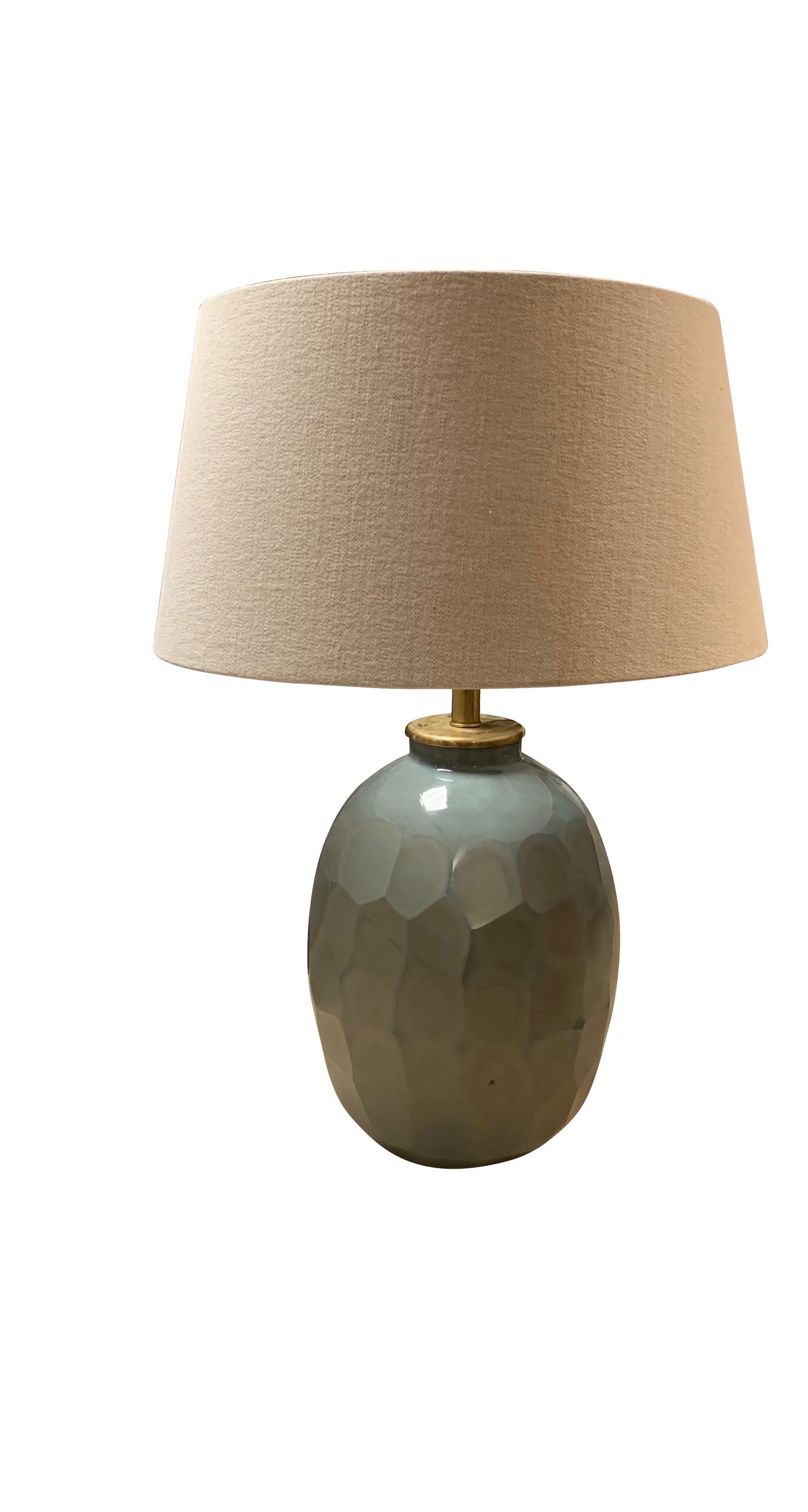 Contemporary Chinese pair of prism cut pale blue glass lamps.
The prism cut glass creates a honeycomb pattern.
Belgian linen shades
Measures: Overall height 29