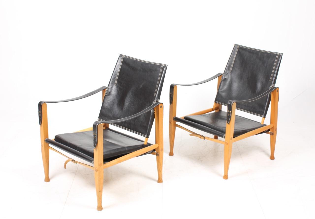 Pair of safari chairs in patinated leather. Designed by Maa. Kaare Klint for Rud Rasmussen Cabinetmakers of Denmark in 1933. Great original condition.