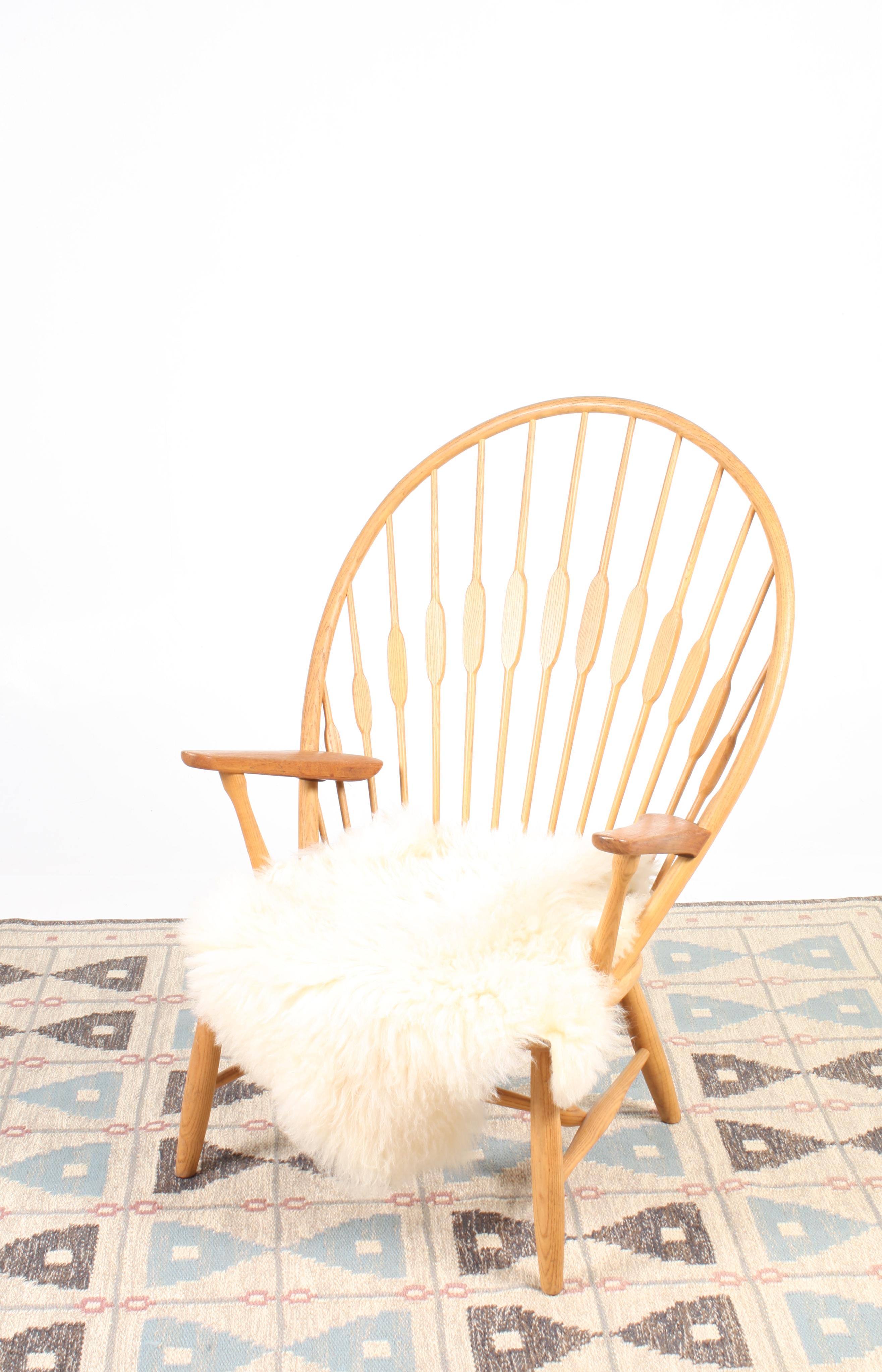 Pair of Pristine Peacock Chairs by Wegner 1