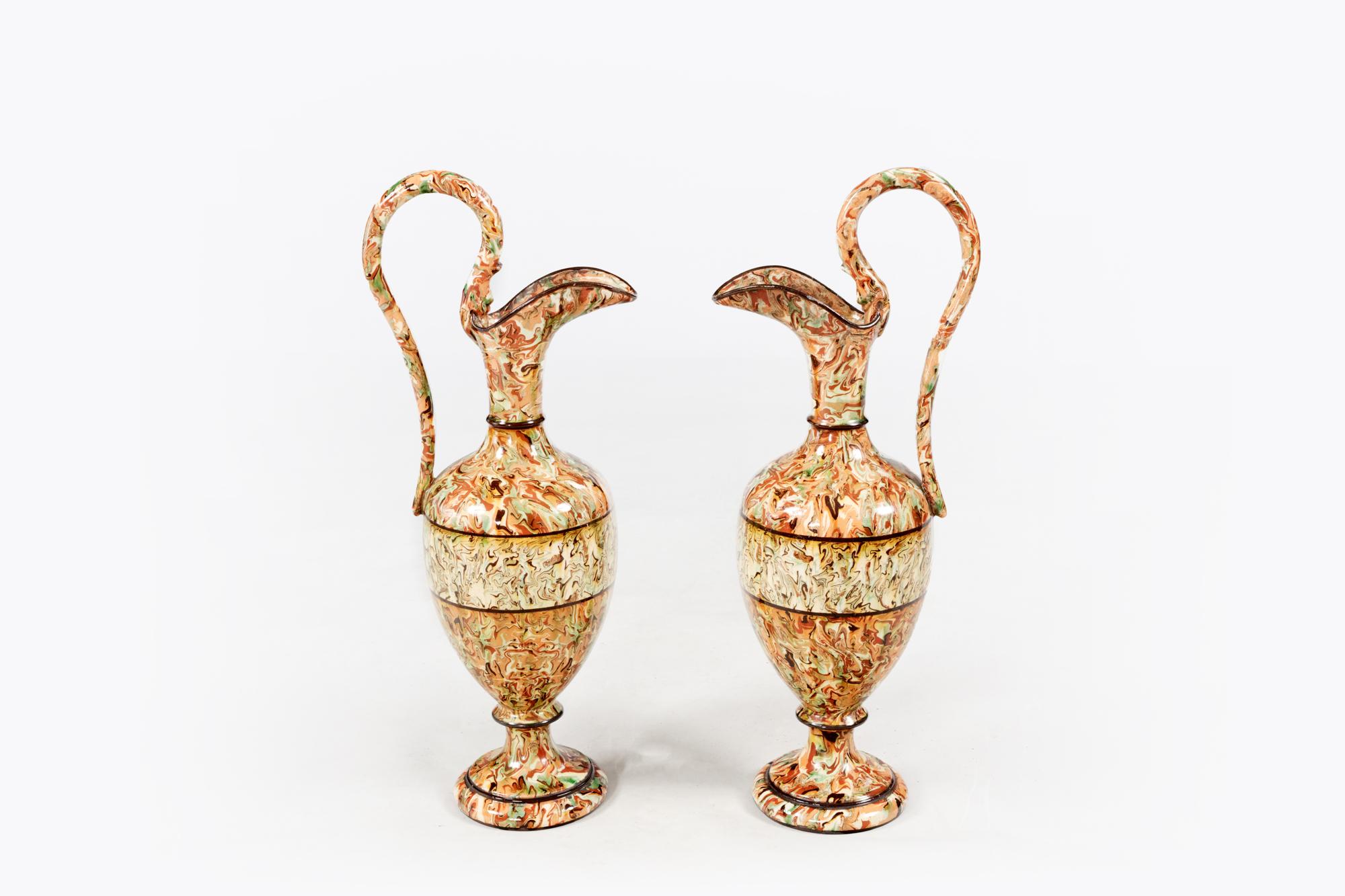 Pair of Provençale 19th century agateware ewers by Pichon, Uzes, France C.1880

Agateware is pottery decorated with a combination of colored clays to create an effect similar to agate gemstone.
 