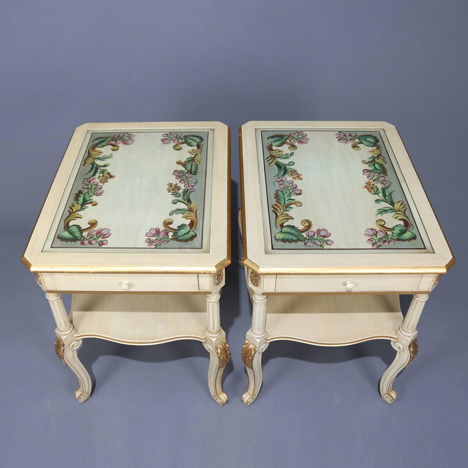 Pair of French Provincial style paint decorated end stand feature top with scroll and foliate motif over single drawer cut-corner case having gilt rosettes, lower shelf raised on Corinthian column supports seated on carved S-scroll cabriole legs