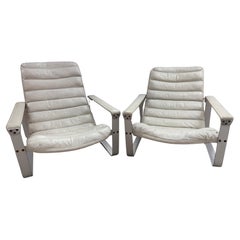 Pair of Pulkka leather Lounge chairs by Ilmari Lappalainen for Asko, circa 1960