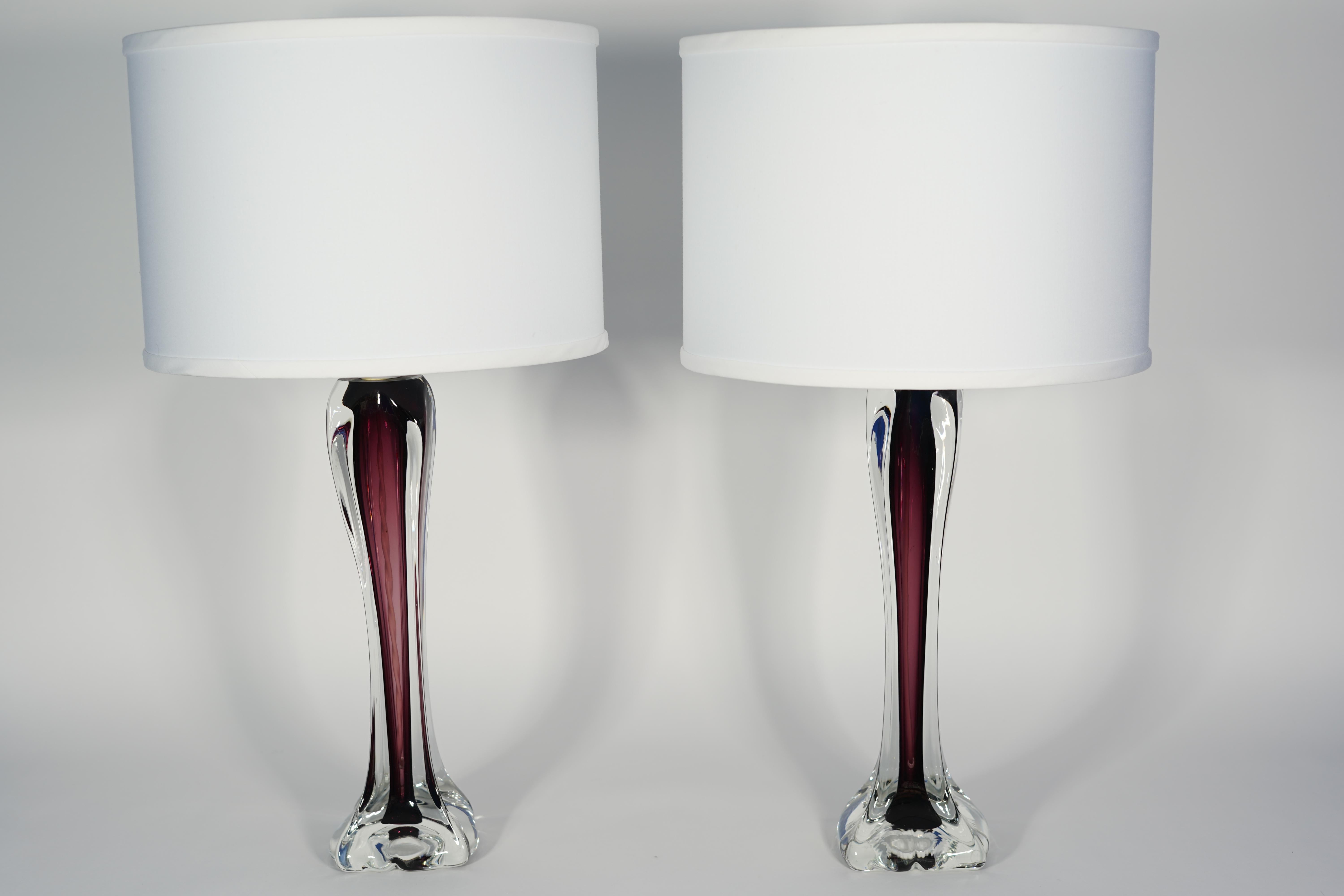 Pair of table lamps by Flygsfors purple glass incased in a clear outer surface, Sweden, 1970.

Rewired for the US.