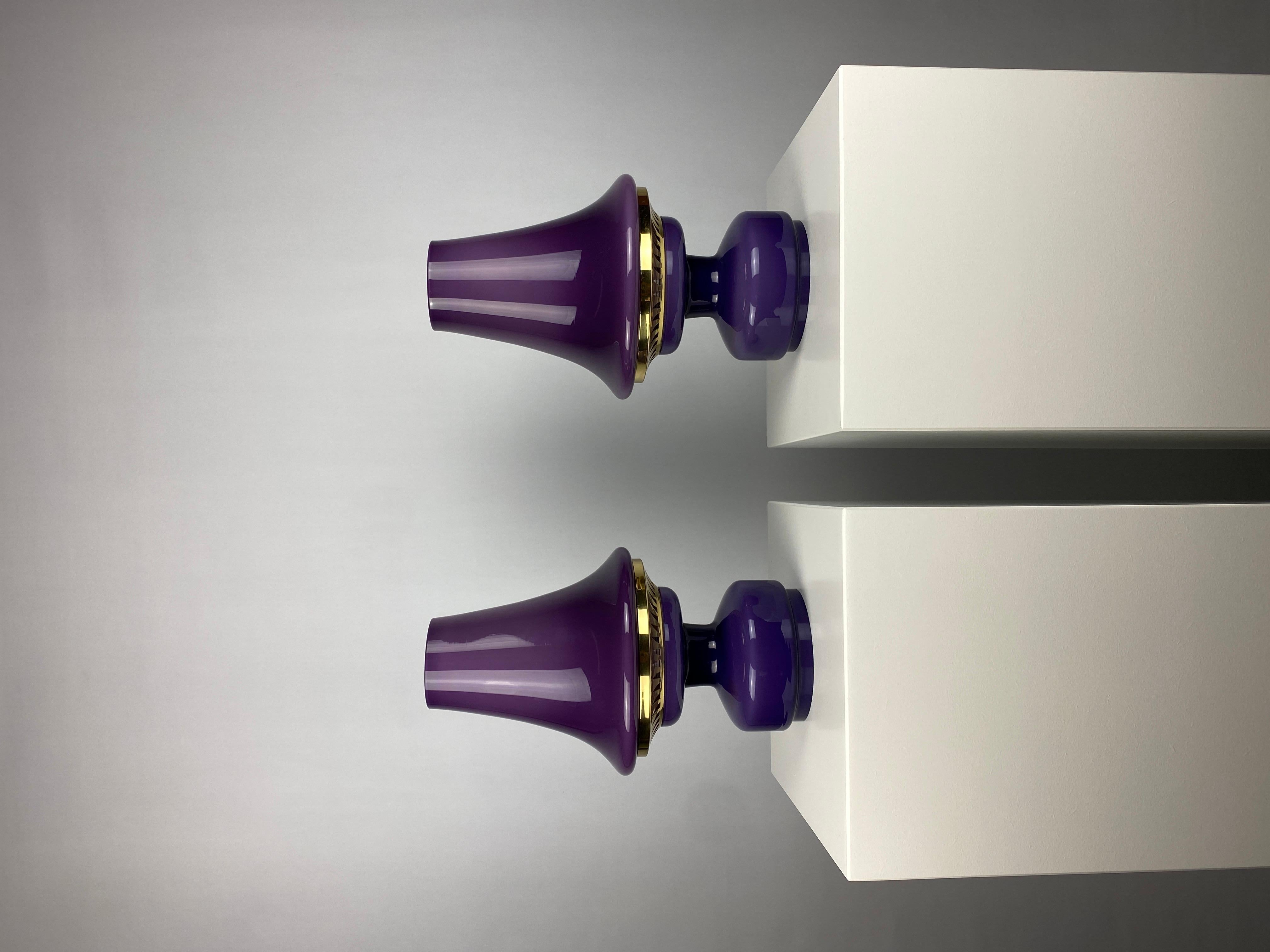 Beautiful pair of purple and brass table lights by Hans Agne Jakobsson for AB Markaryd. Model is called B-124 and they are produced around 1970. 

The color is really something, beautifully mouth blown purple opaline glass combined with the brass