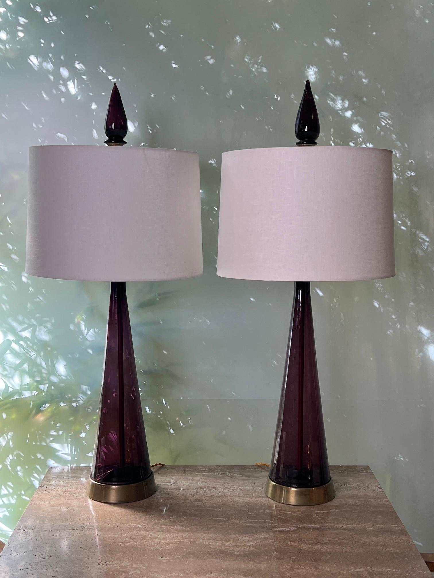 A pair of deep purple glass table lamps with brass bases and matching glass finials by Marbro. 
Rewired.
Shades not included.
