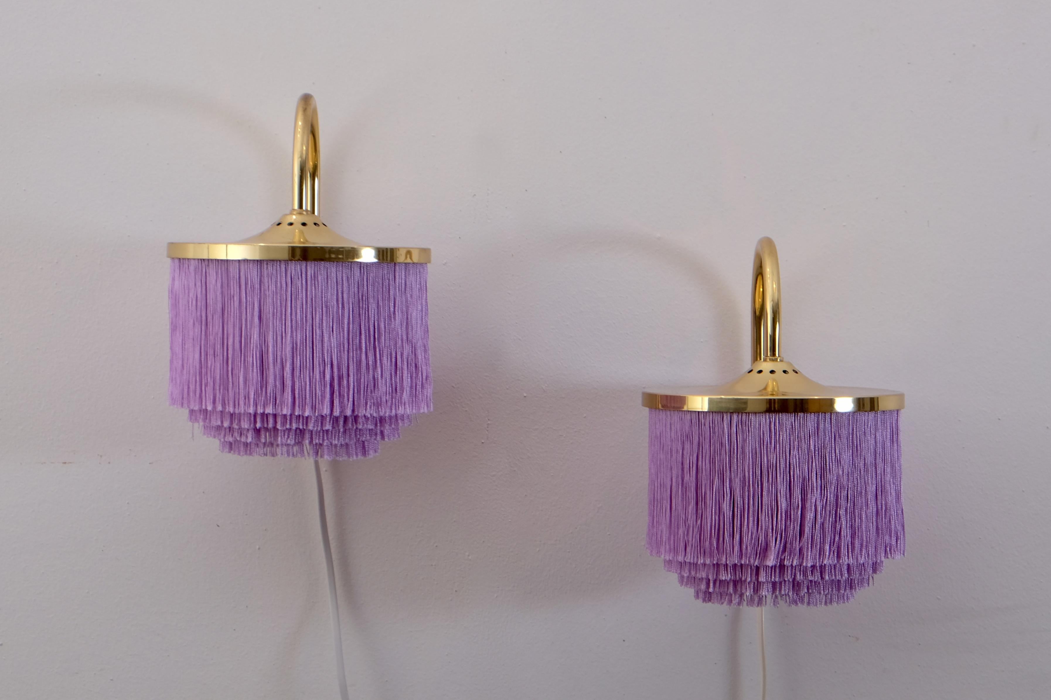 Set of 4 available. Swedish purple fringes wall light model V271 designed by Hans-Agne Jakobsson, produced in Markaryd, Sweden, 1960s.
Listed price is for a pair.

Measures: Diameter 16.5 cm
Distance from wall 19.5 cm
Top of arm to bottom of