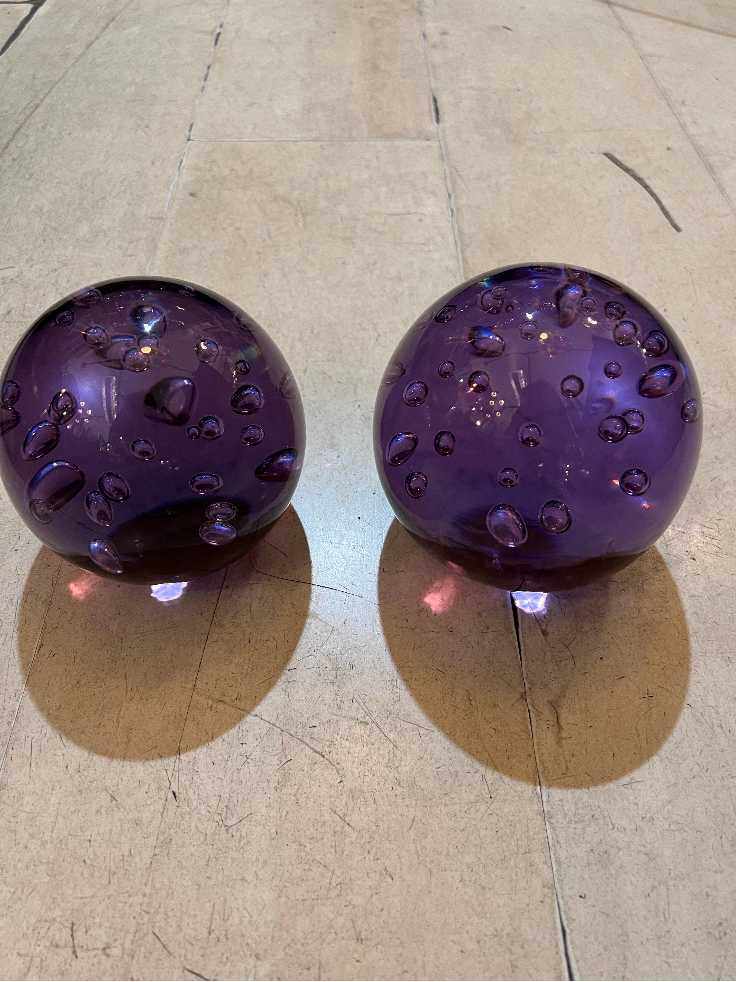 Pair of Purple Murano Glass Paperweights with air bubble included.
The glass sculture is solid and heavy, the air bubbles have been handblown, one sphere is slightly smaller than the other. Can be sold separately.