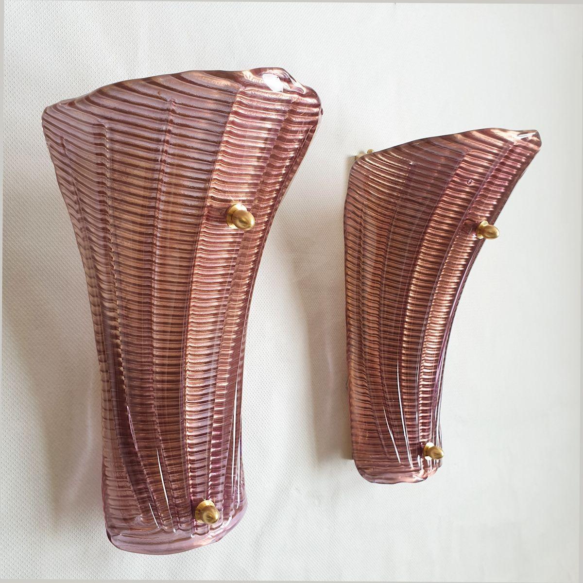 Pair of large Purple Mid-Century Modern Murano glass sconces, attributed to Mazzega, Italy 1980s.
The sconces have brass fittings, with one light bulb each.
The pair has been rewired for the US.
The Murano glass has a regular pattern; it's purple