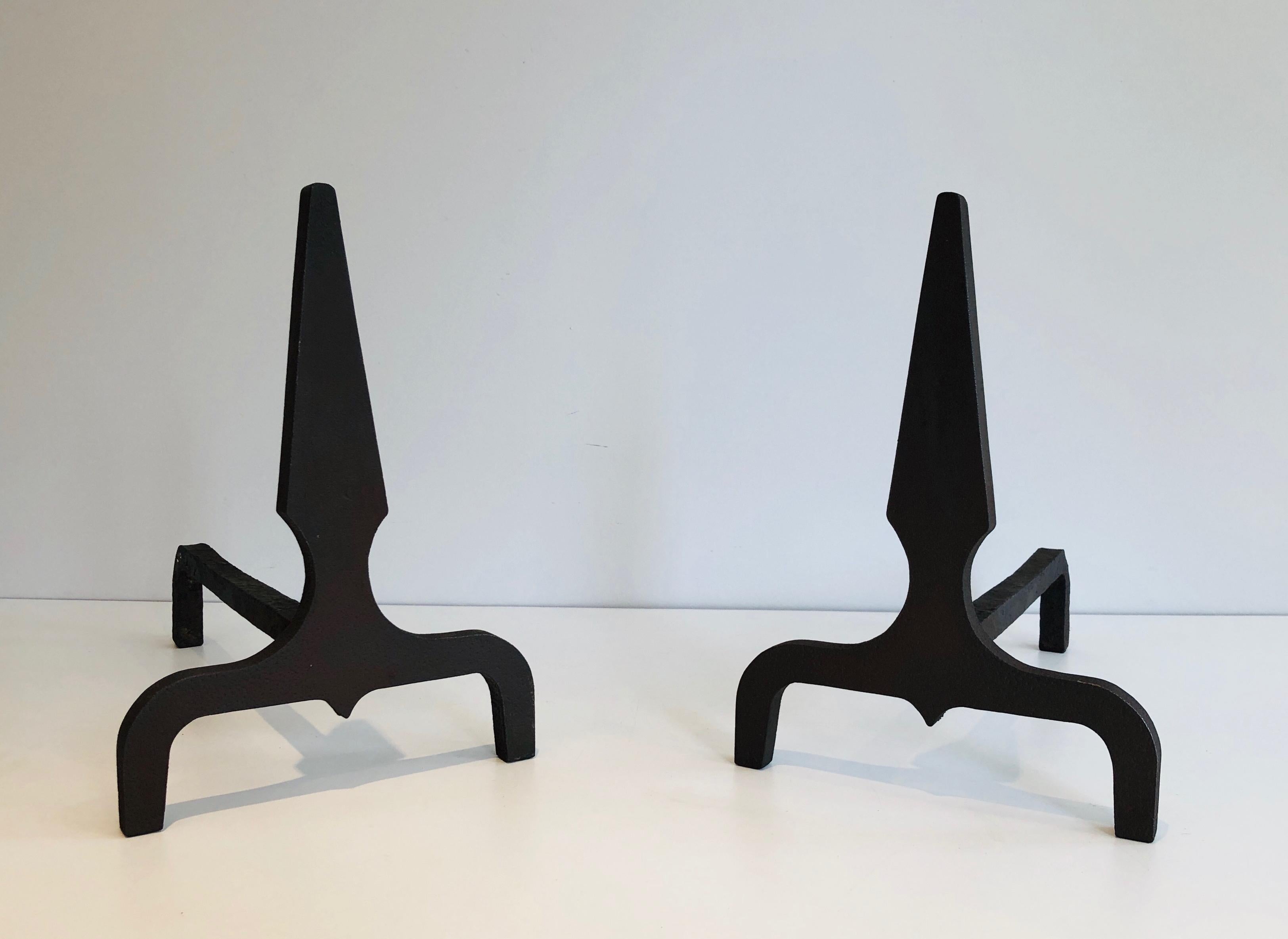 This elegant pair of pyramid andirons is made of steel and wrought iron. This is a French work, circa 1940.