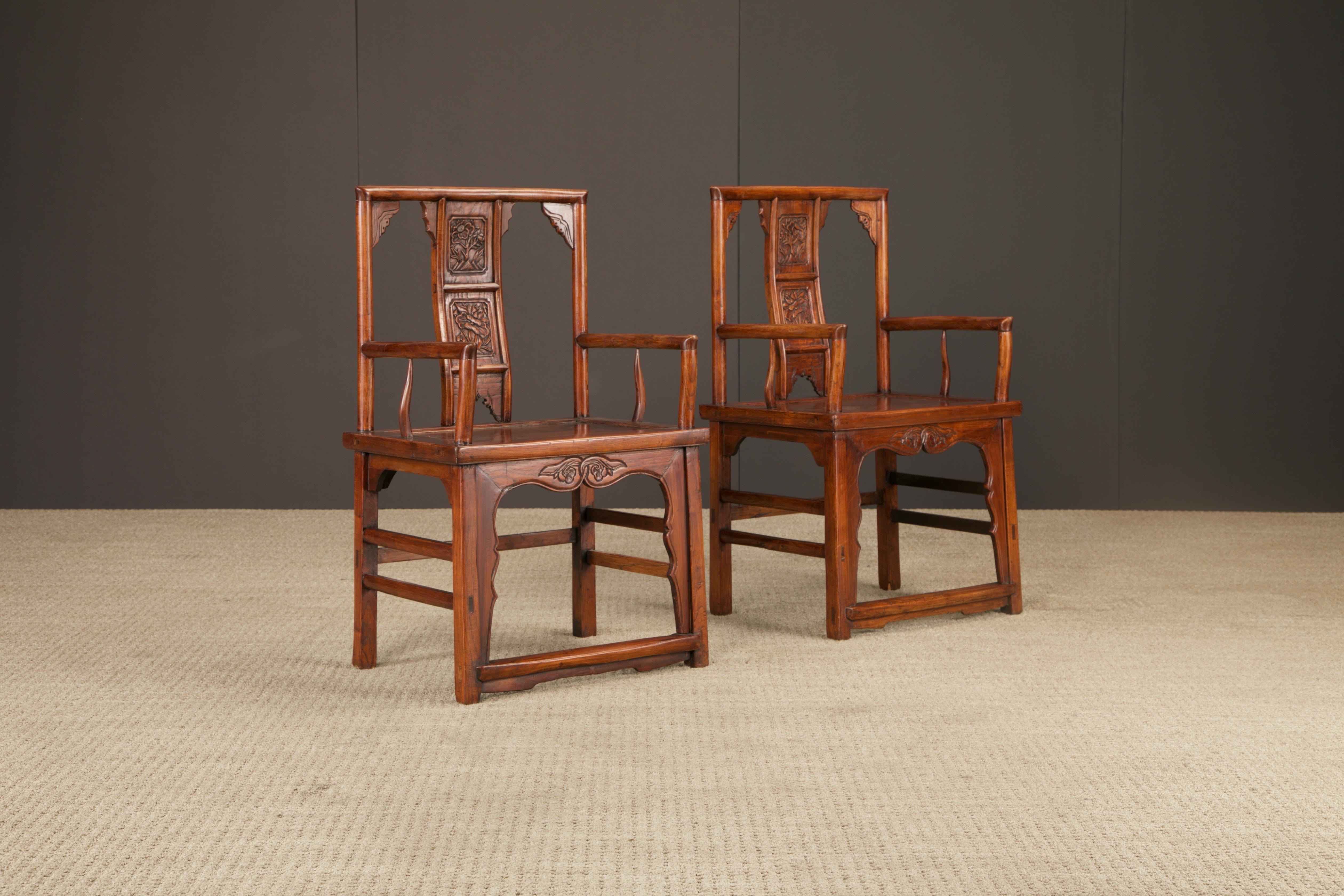 A refined pair of Chinese armchairs, crafted in solid elmwood and likely dating to the Qing Dynasty period (1644–1912), late 19th to early 20th century (we are listing this as 'attributed to late Qing Dynasty but cannot guarantee this). These chairs
