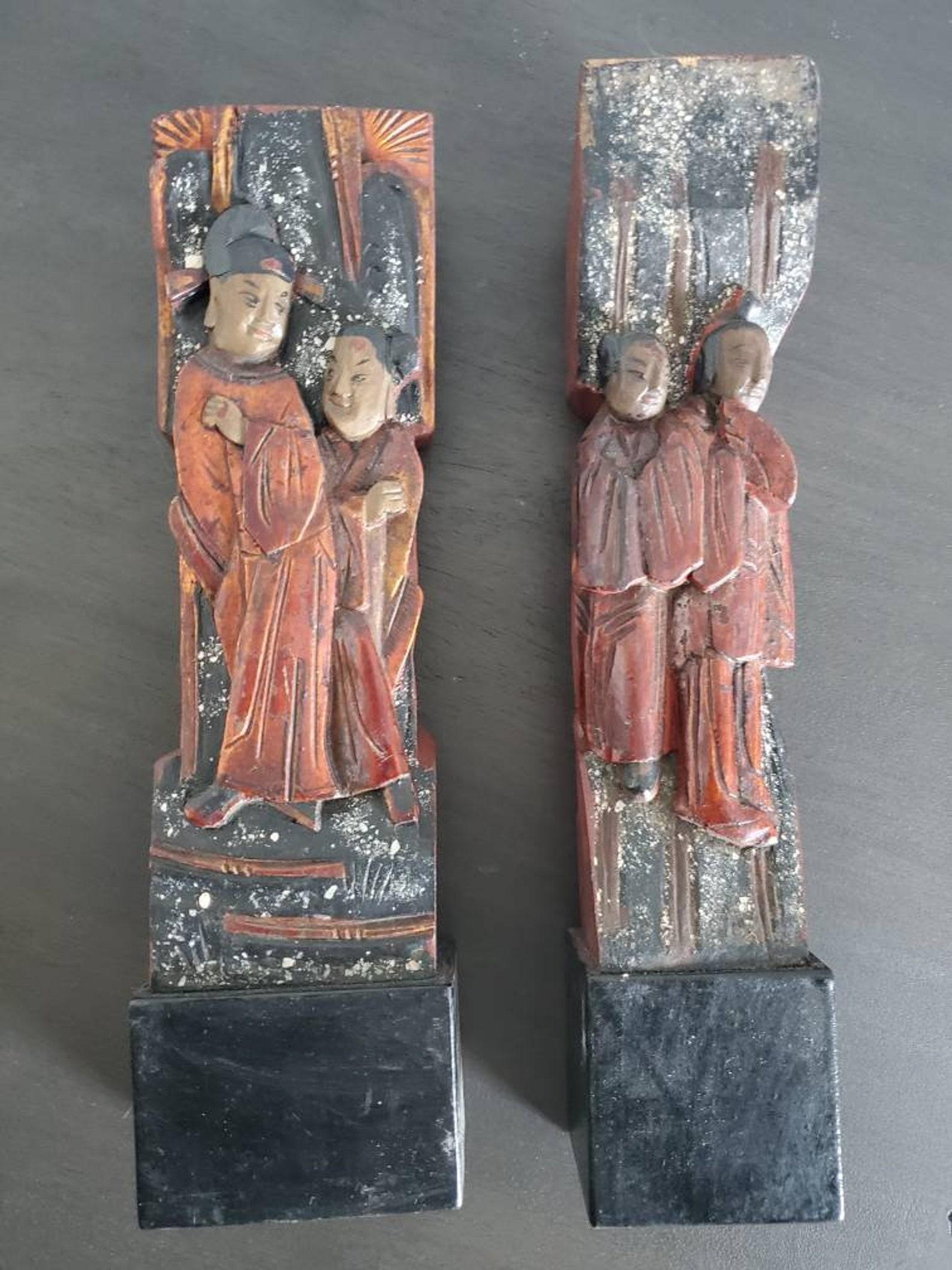 A scarce pair of Qing Dynasty temple architectural ornaments, the decorative antique building element fragments each elaborately hand carved, polychrome painted and lacquered, richly detailed featuring two figural pairs accented by beautiful,