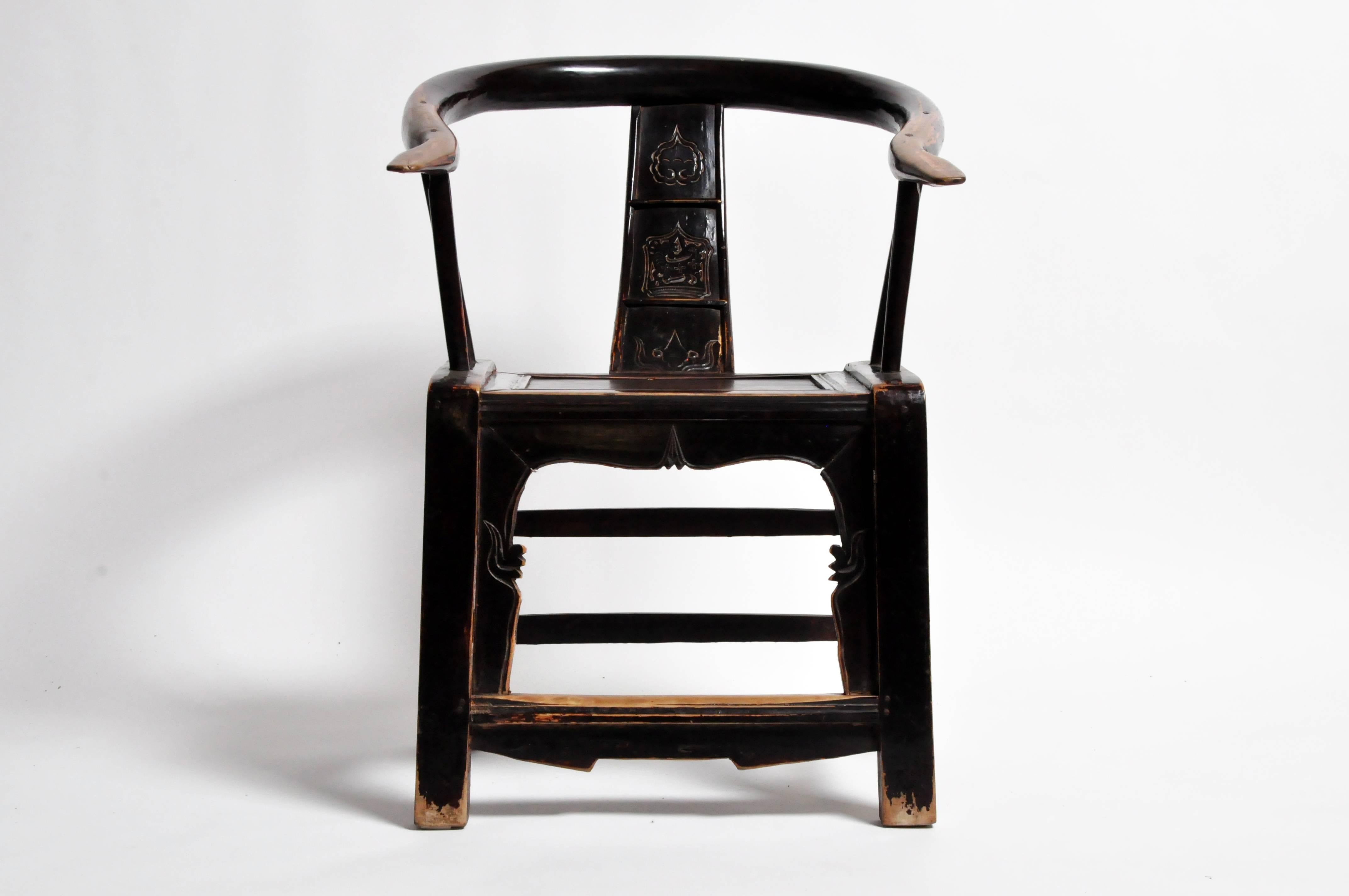 This late Qing dynasty pair of round back chairs are from Shandong, China and were made from yang mu wood. They both feature a beautifully aged original patina and a foot rest.