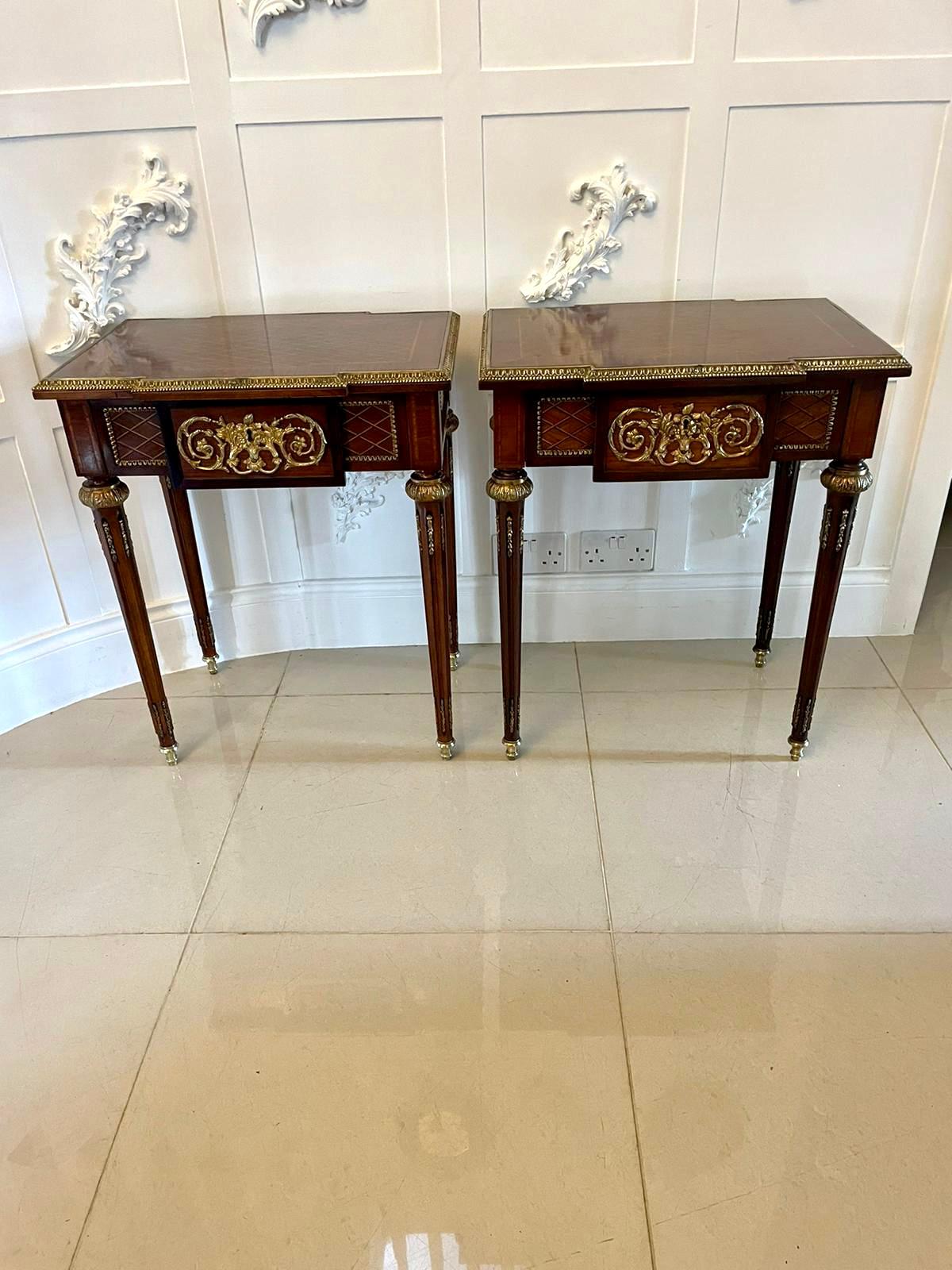 Pair of quality antique French kingwood freestanding lamp or bedside tables having a quality inlaid kingwood top with an ornate ormolu edge, inlaid freestanding frieze with a single drawer and ornate ormolu mounts standing on four turned tapering