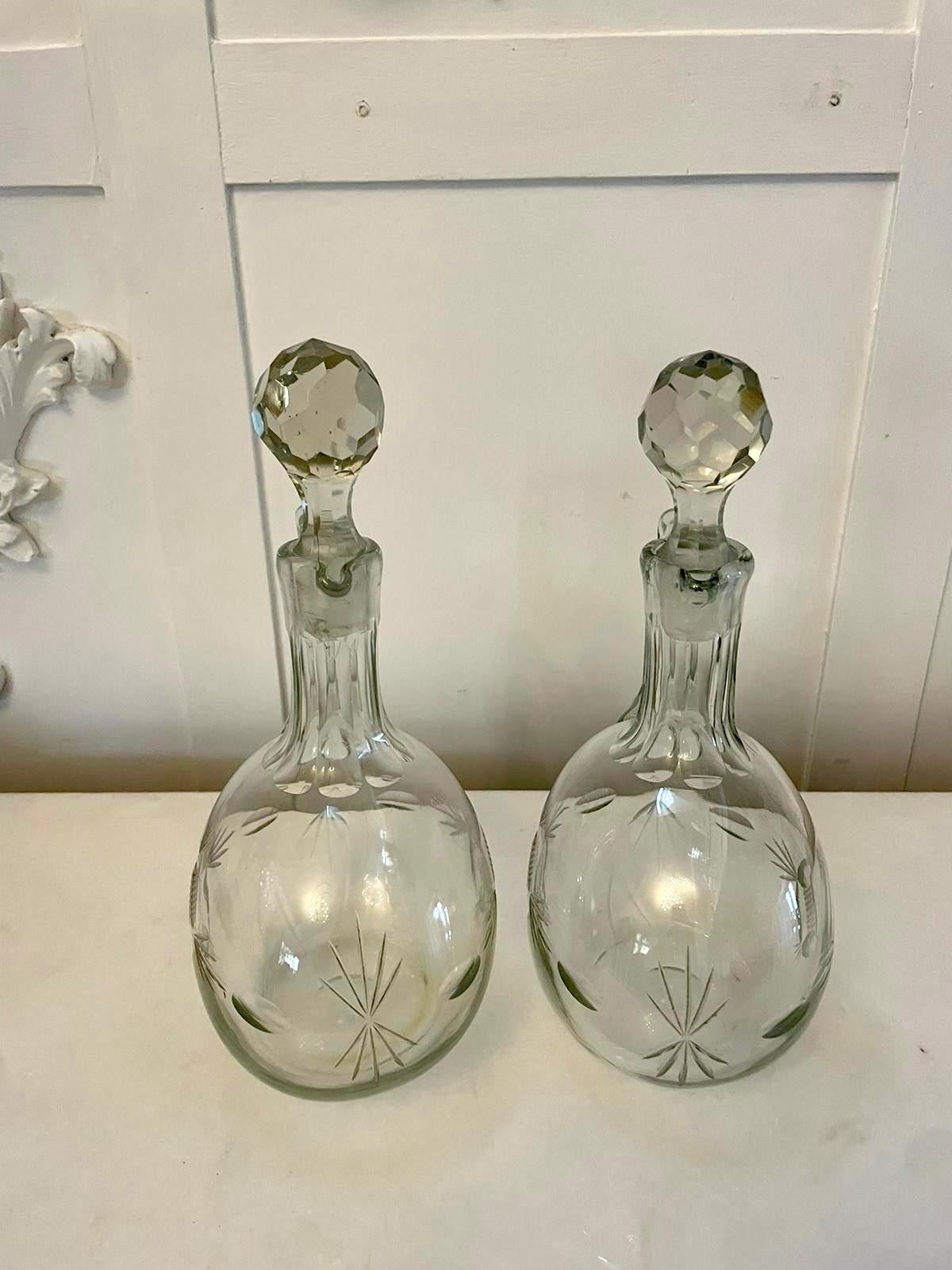 Pair of quality antique Victorian cut glass decanters having a pair of quality antique Victorian cut glass decanters with shaped handles and original stoppers 

In lovely original perfect condition

Dimensions:
Height 27 cm (10.62 in)
Width 15