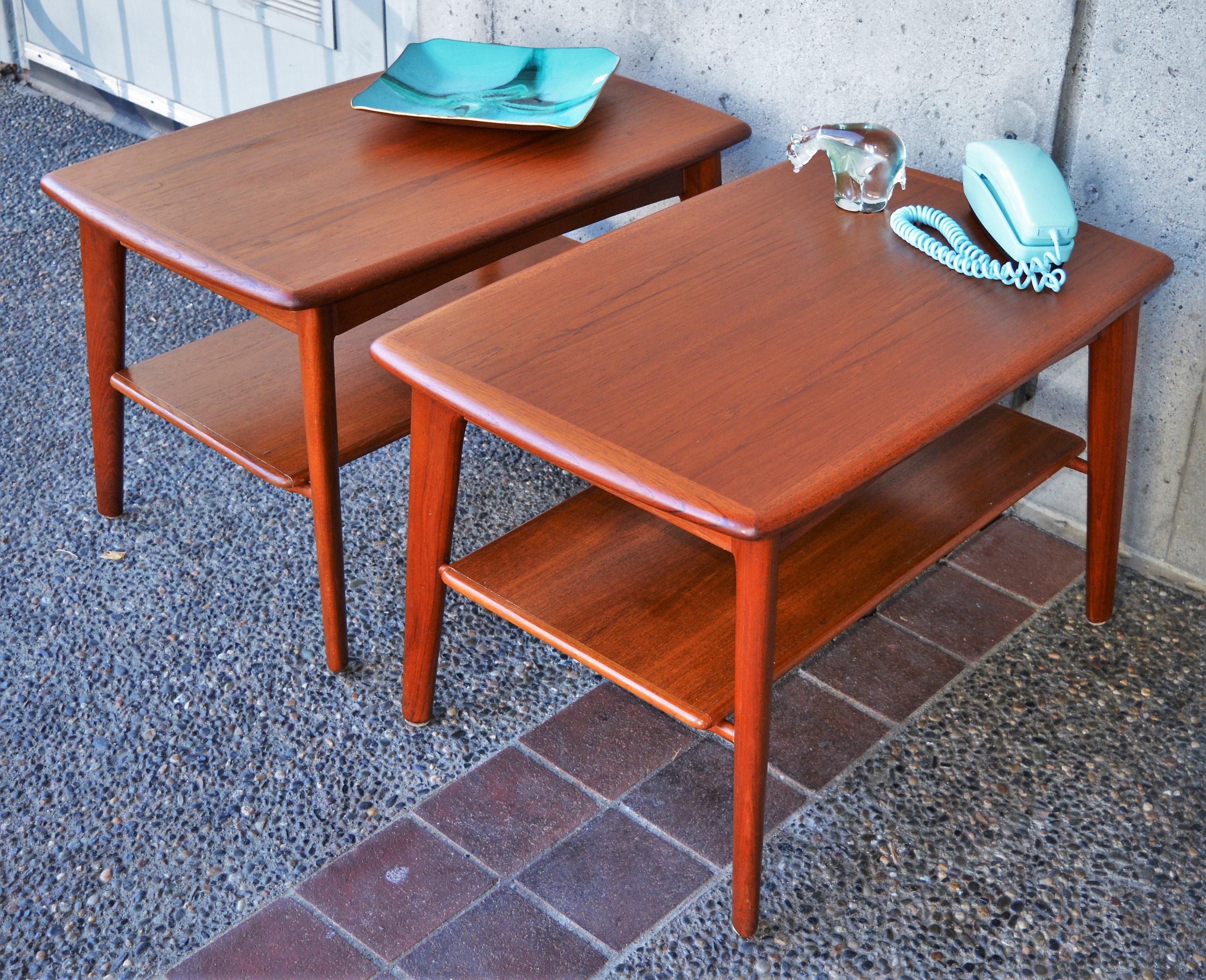 This pair of teak side tables are truly exquisite! Note the impeccable sculptural details throughout, the flared shapes of the table tops, the splayed legs, the sculptural shelf supports etc. Designed by Svend Madsen in the 1960s. Featuring a hidden