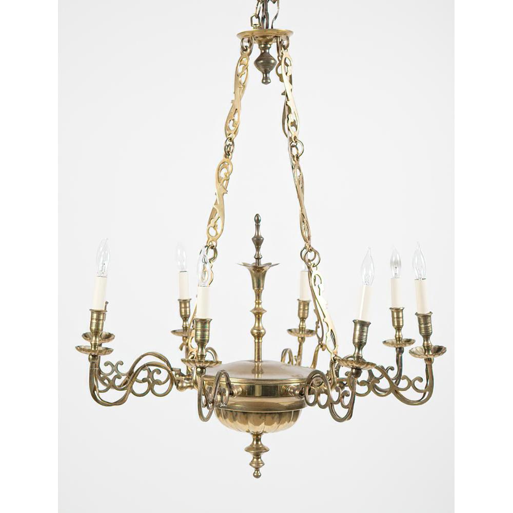Pair of Queen Anne brass eight-light chandeliers with brass chain supports and urn form central finial.