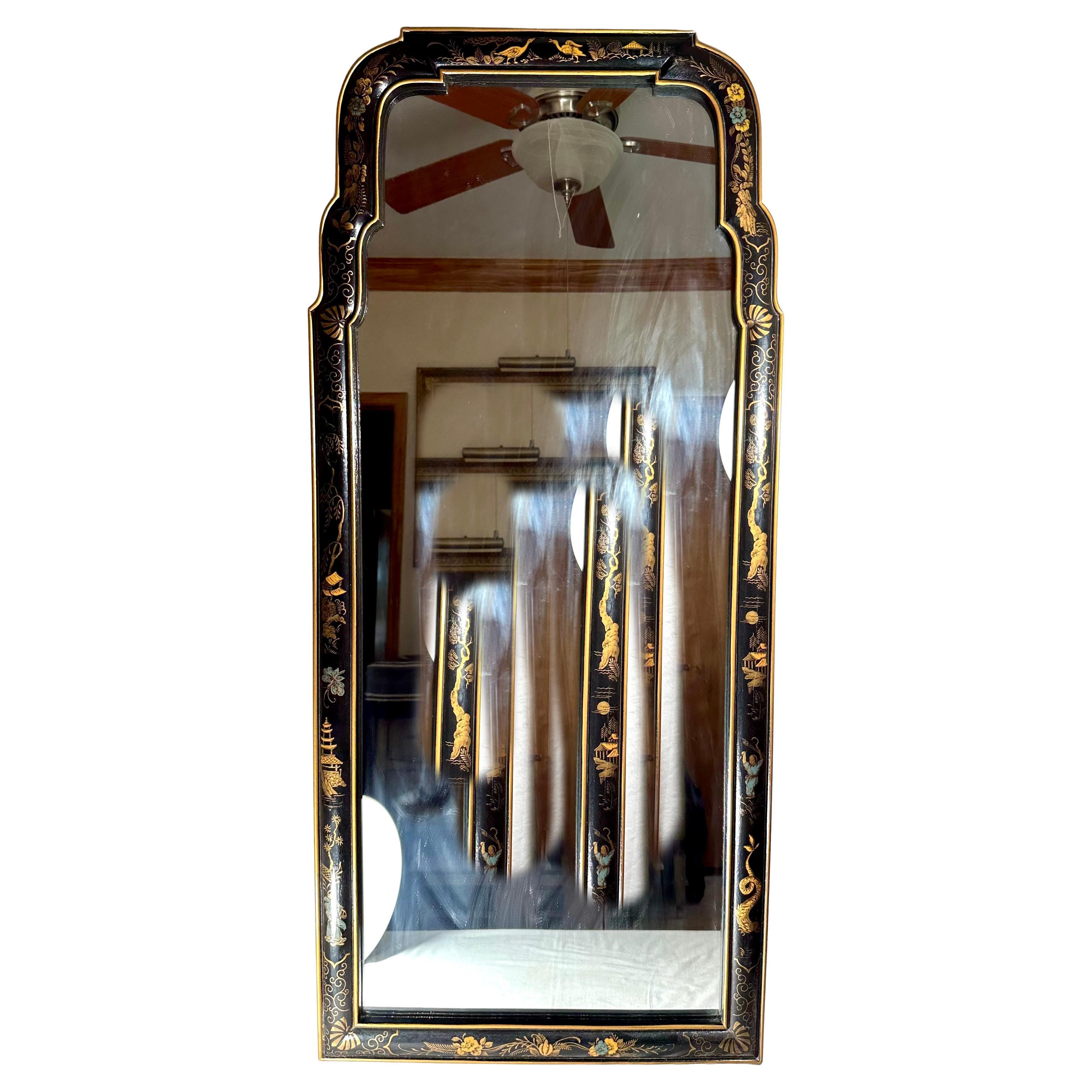 Pair of Queen Anne Style Parcel Gilt Black Japanned Mirrors.

Perfectly matched pair of elegant wall mirrors with lacquered and gilt hand painted frames with scalloped edges. 2 mirrors with shaped cresting continuing to form the surround, decorated
