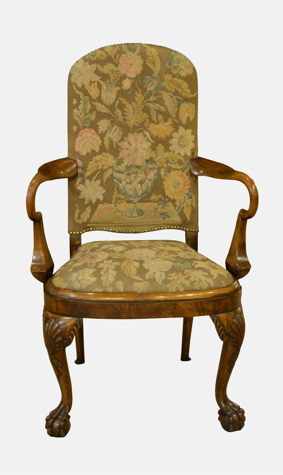 A pair of walnut open-arm Queen-Anne style armchairs with Flemish flat-weave tapestry coverings, circa 1910.