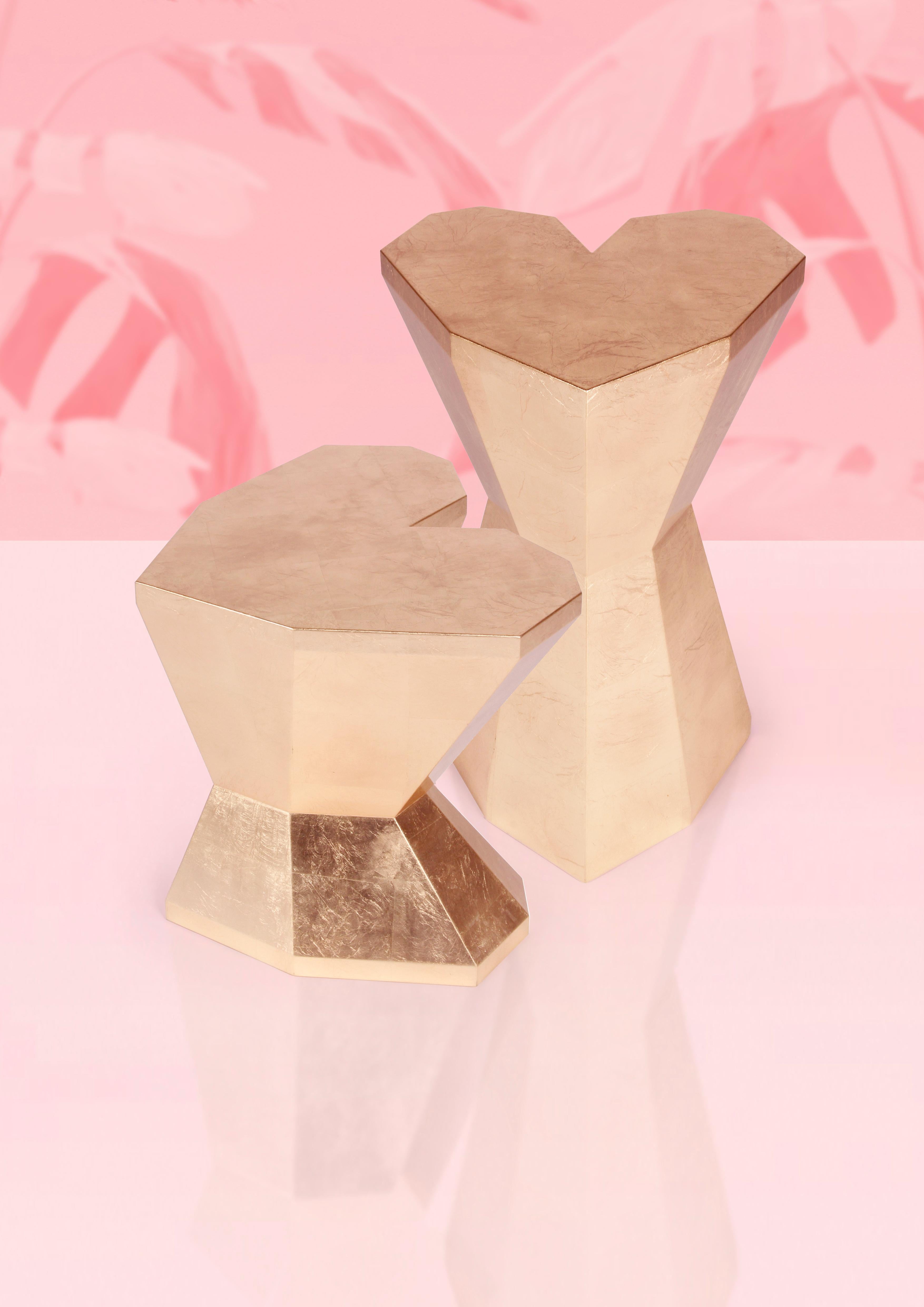 Pair of Queen heart side tables by Royal Stranger
Dimensions:
Tall: Width 45 x 65 x 47 cm
Short: 50 x 60 x 62 cm
Materials: Glossy varnish on the gold leafed wood structure.

This Royal and romantic pair of side tables makes you wander to