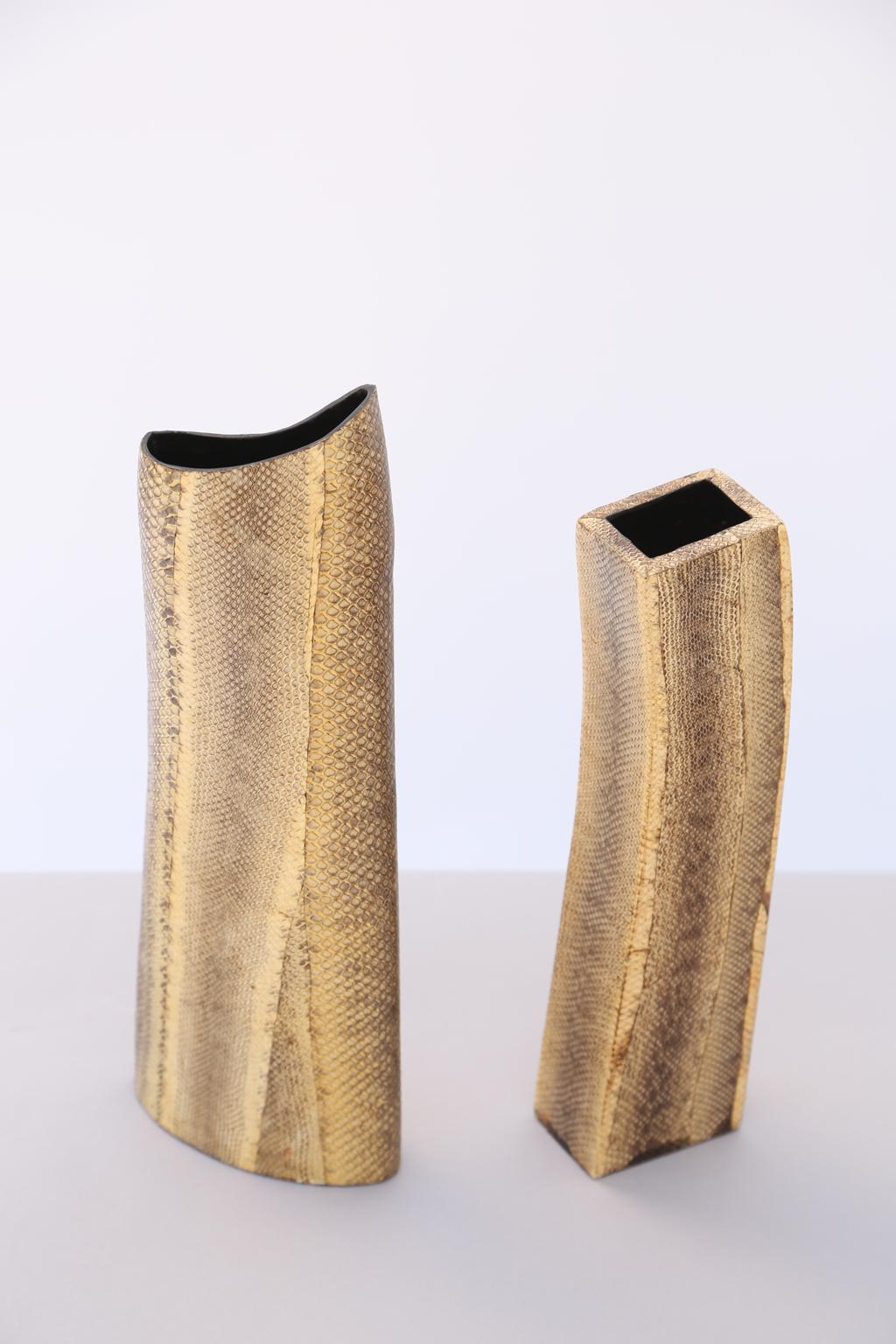 Pair of unusual vases, each freeform shape, clad in snakeskin by Ria and Yiouri Augousti. Rectangular vase measures approximately 12.75