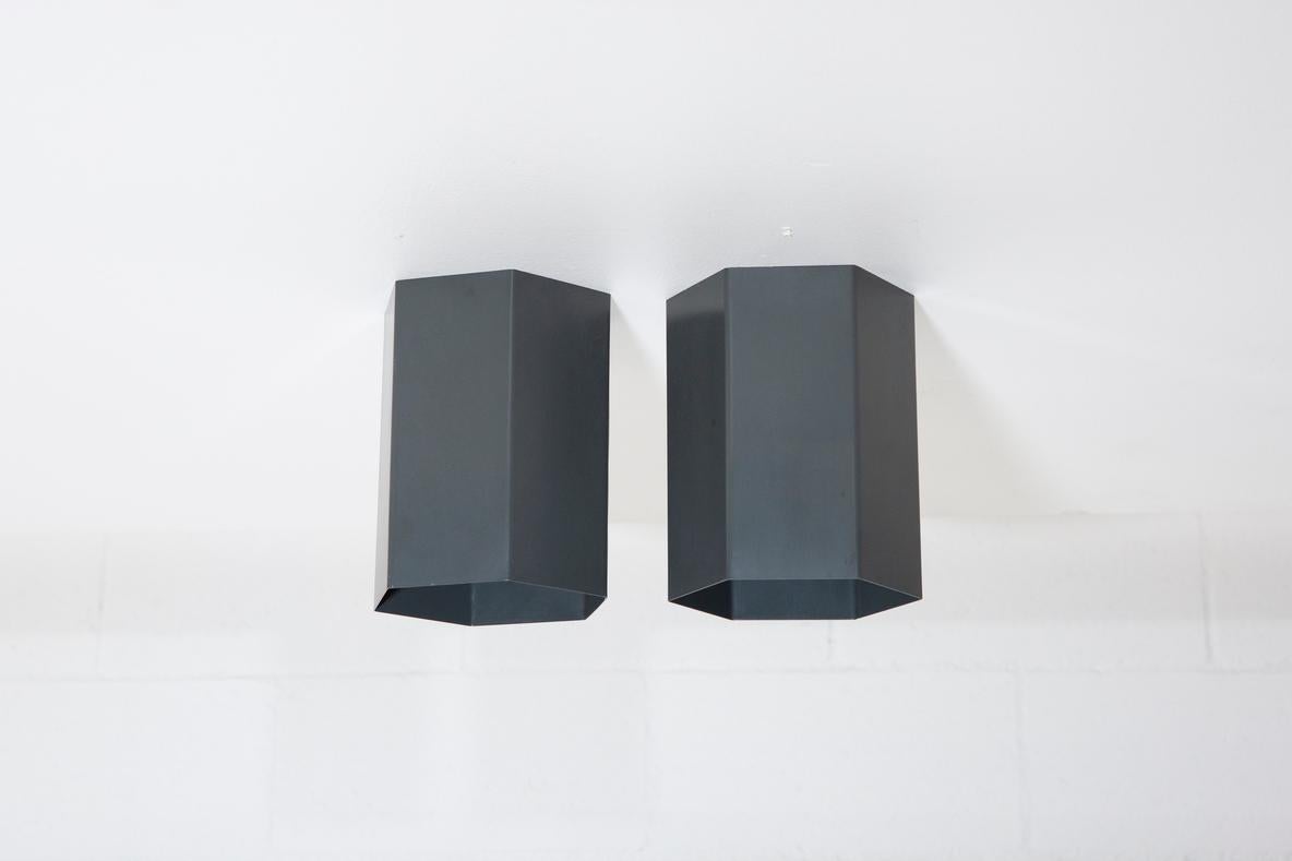 Handsomely designed, Raak attributed, enameled metal hexagonal flush mount lights. Mountable to ceiling or wall. In original condition with age appropriate wear. Sold as pair.