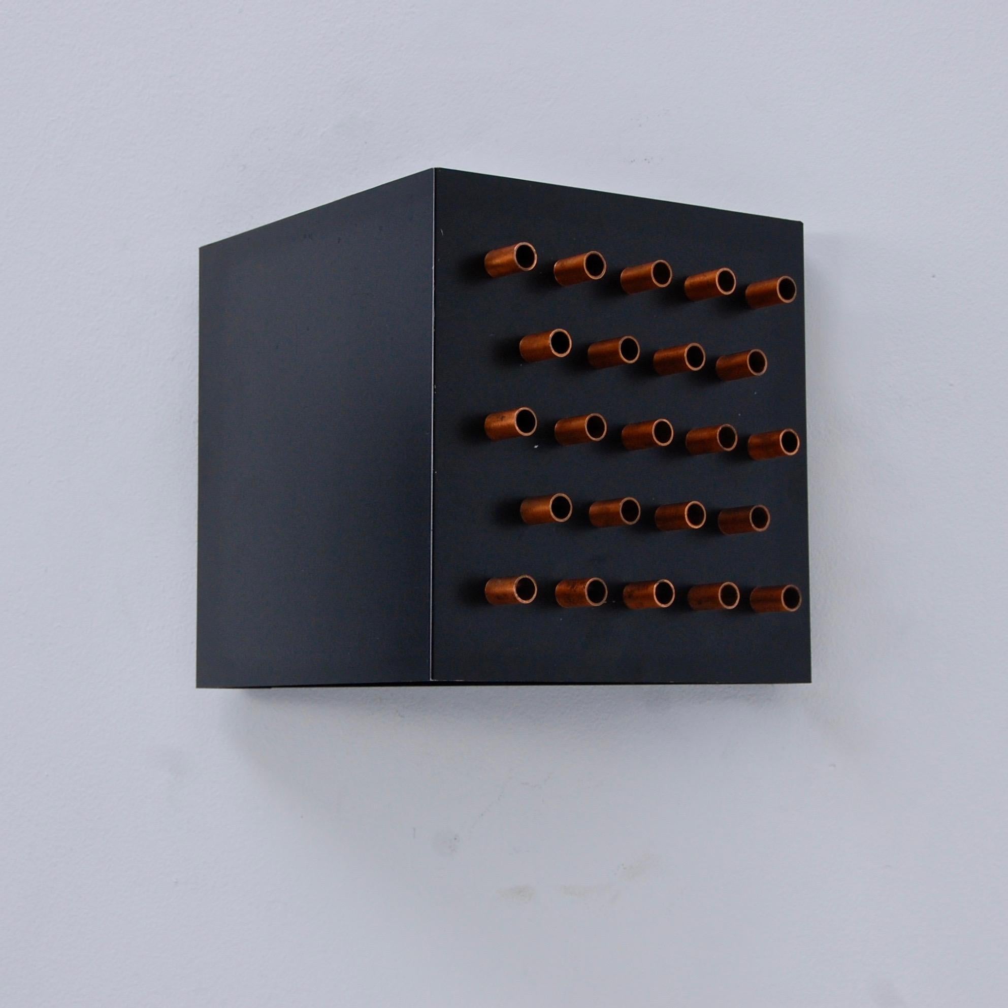 Pair of cube 1960s ‘Claire Obscure’ sconces by RAAK of Amsterdam. Partially restored in steel and copper. Single E26 based socket per sconce. Maximum wattage 75 watts per sconce. Currently wired for use in the US. Priced as a