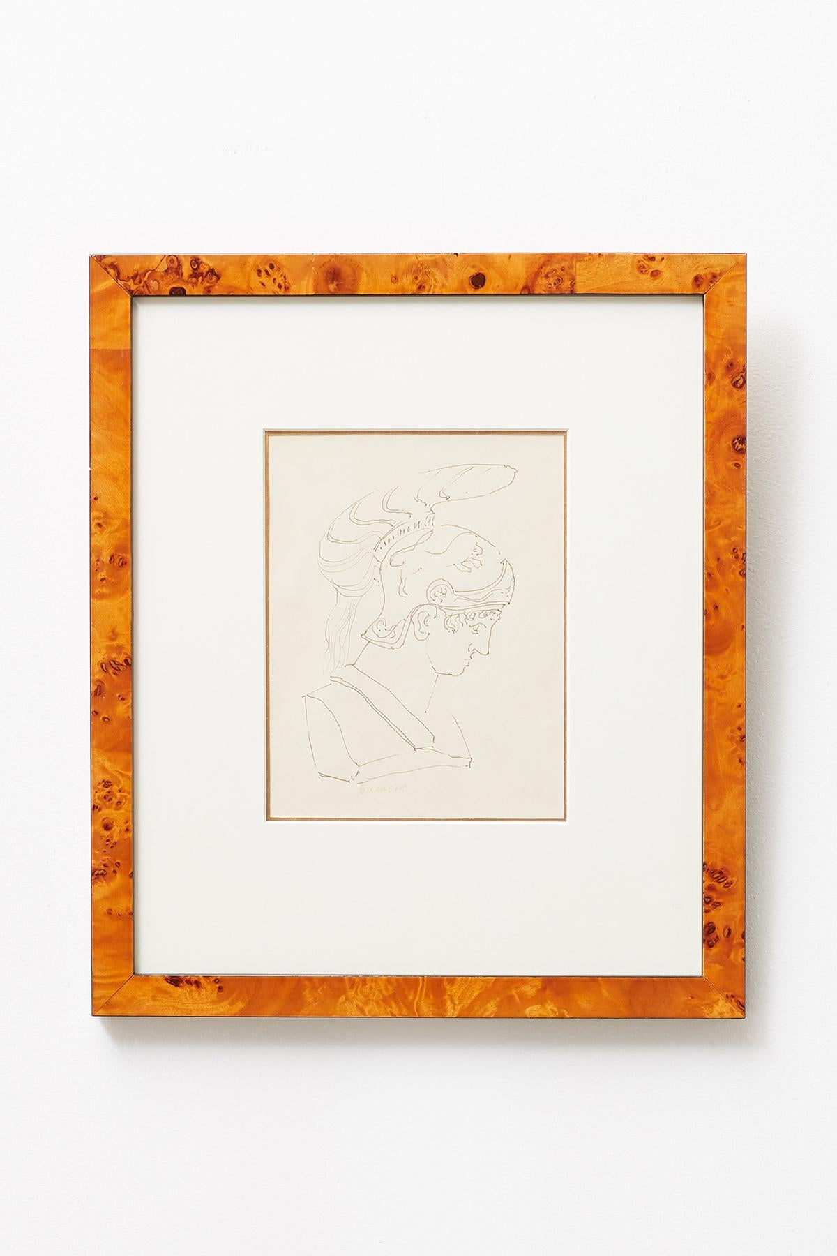 Exquisite pair of Greco-Roman pen and ink drawings by San Francisco artist Ralph DuCasse (1916-2003 American). Both signed on bottom, one of a warrior, and the other of the colosseum in Rome titled Colossed. Each framed in a burl veneered frame