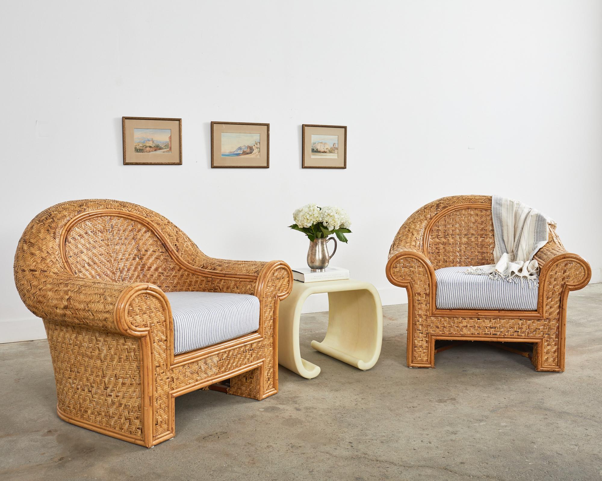 Gorgeous pair of oversized organic modern lounge chairs featuring a woven seagrass style rattan wicker covered frame. Produced by O-Asian for Ralph Lauren Home. The large frame is constructed from rattan poles with wood and covered with woven rattan