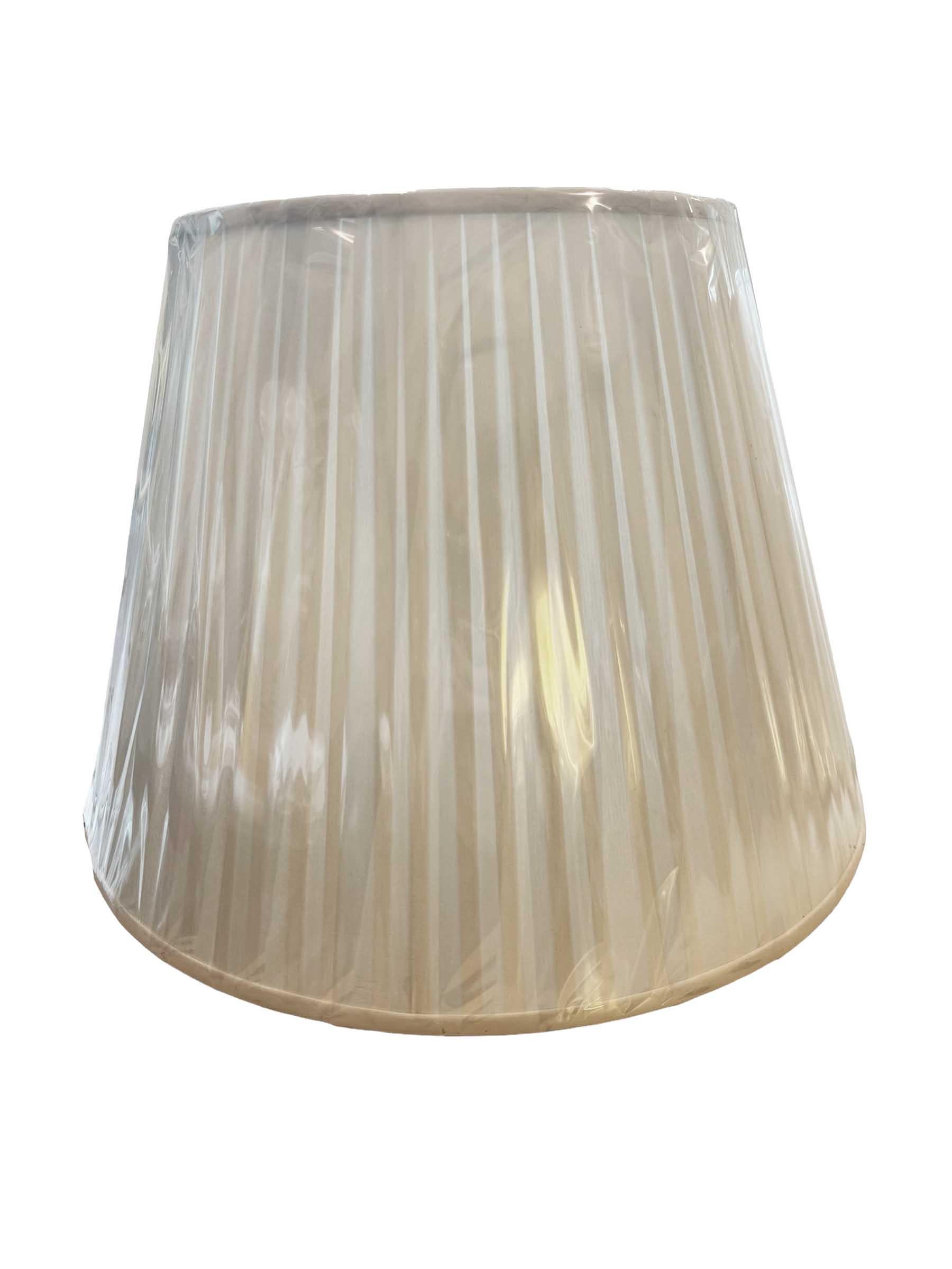 Elevate the ambiance of your living space with this exquisite pair of Ralph Lauren pleated lamp shades, a timeless addition to any interior decor. Crafted with meticulous attention to detail, each shade exudes sophistication and elegance, boasting